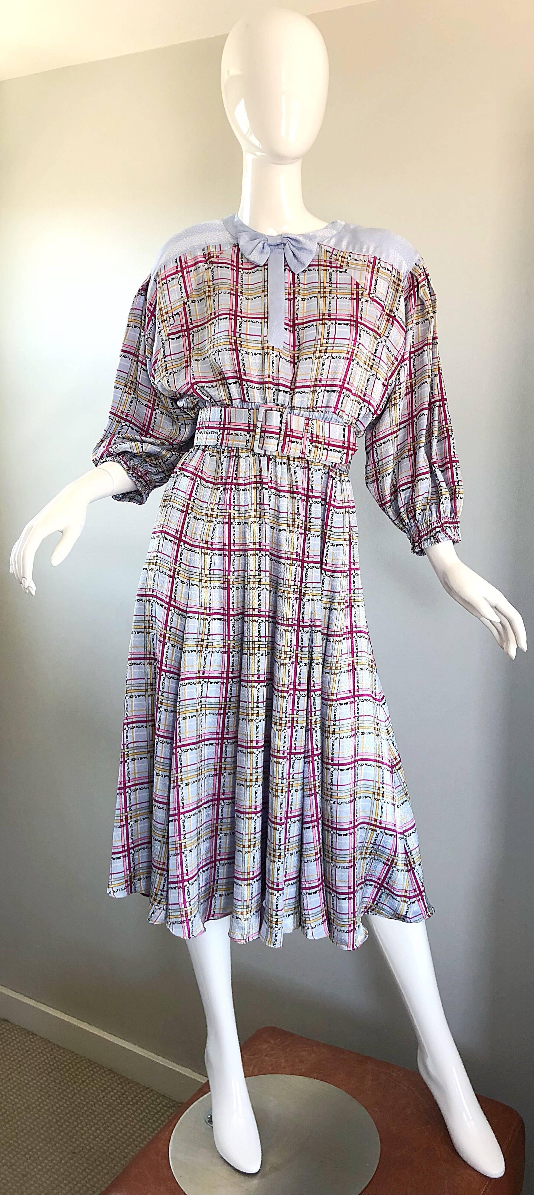 Beautiful 1980s DIANE FREIS belted dress! Classic Freis silhouette is super easy and comfortable to wear, without sacrificing style. Soft pastel shades of purple and pink, with just a bit of yellow. Hidden buttons up the front neck with a chic bow