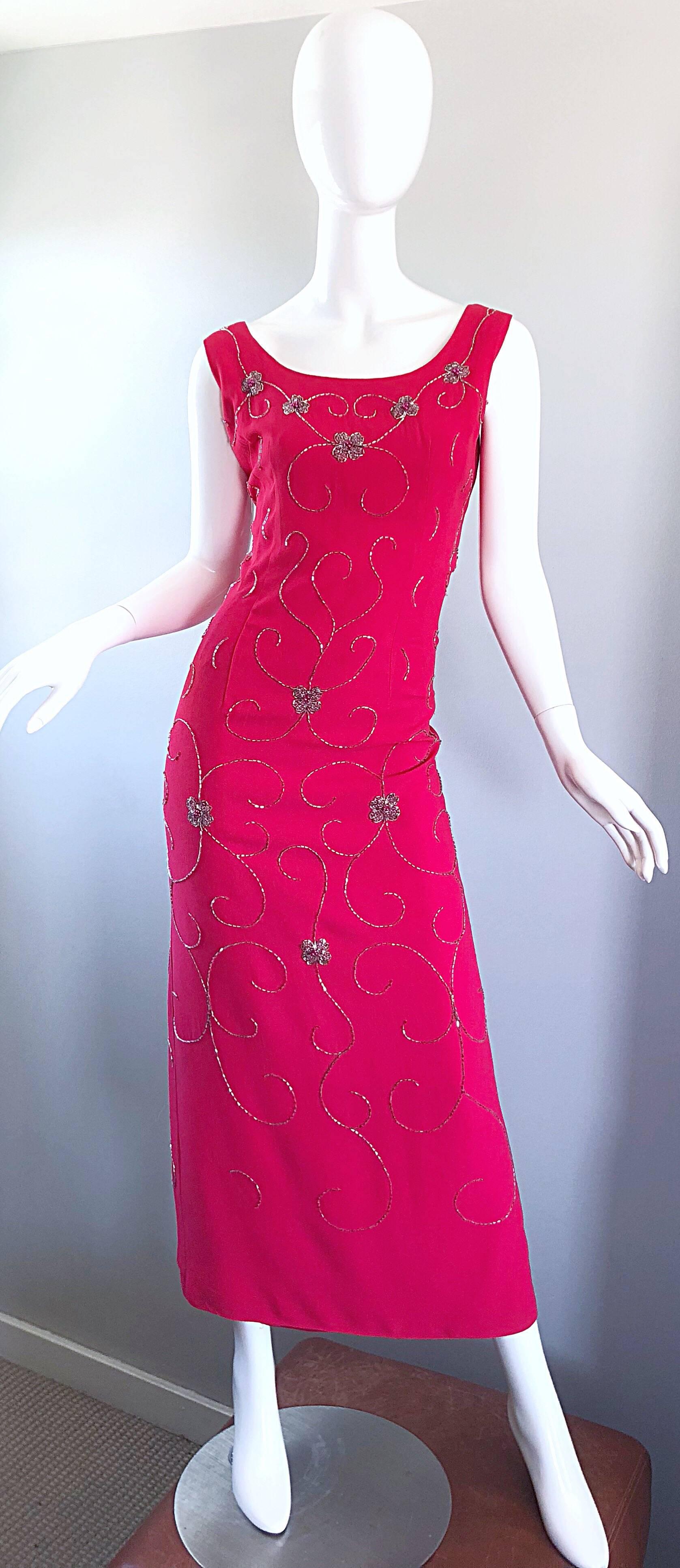 Gorgeous, and very well made 1960s hot pink fuchsia and silver beaded crepe gown! Wonderful flattering fit that hugs the body in all the right places. Hundreds of hand-sewn silver and pink beads throughout. Slit up the center back. Fully lined. Full
