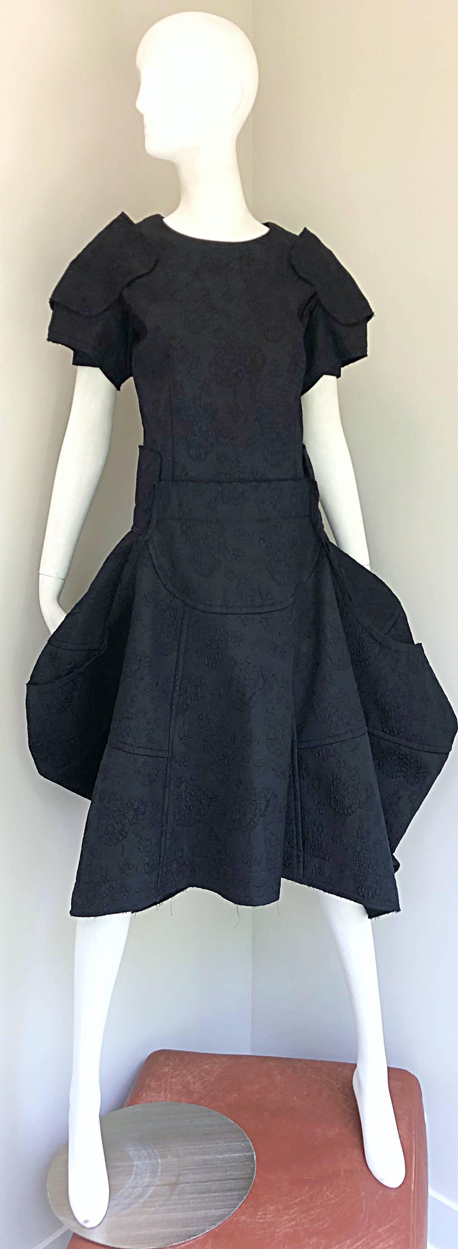 This COMME DES GARCONS black Samurai 2016 Collection dress is proof that fashion can be art! The architecture on the rare musuem quality gem is insane! Limited Edition for collectors. Thoughtfully constructed, with no detail spared. Features a