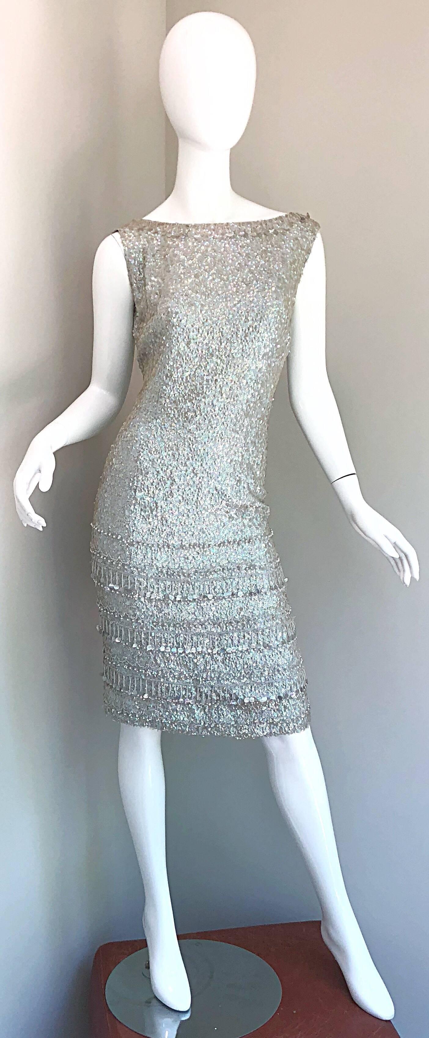 Insanely gorgeous 1950s GENE SHELLY light blue beaded and sequin silk wiggle dress! Gene Shelly typically used wool on her sequin dresses. The silk pieces are rare, and were from the beginning of the fashion label. 
Features thousands of hand sewn