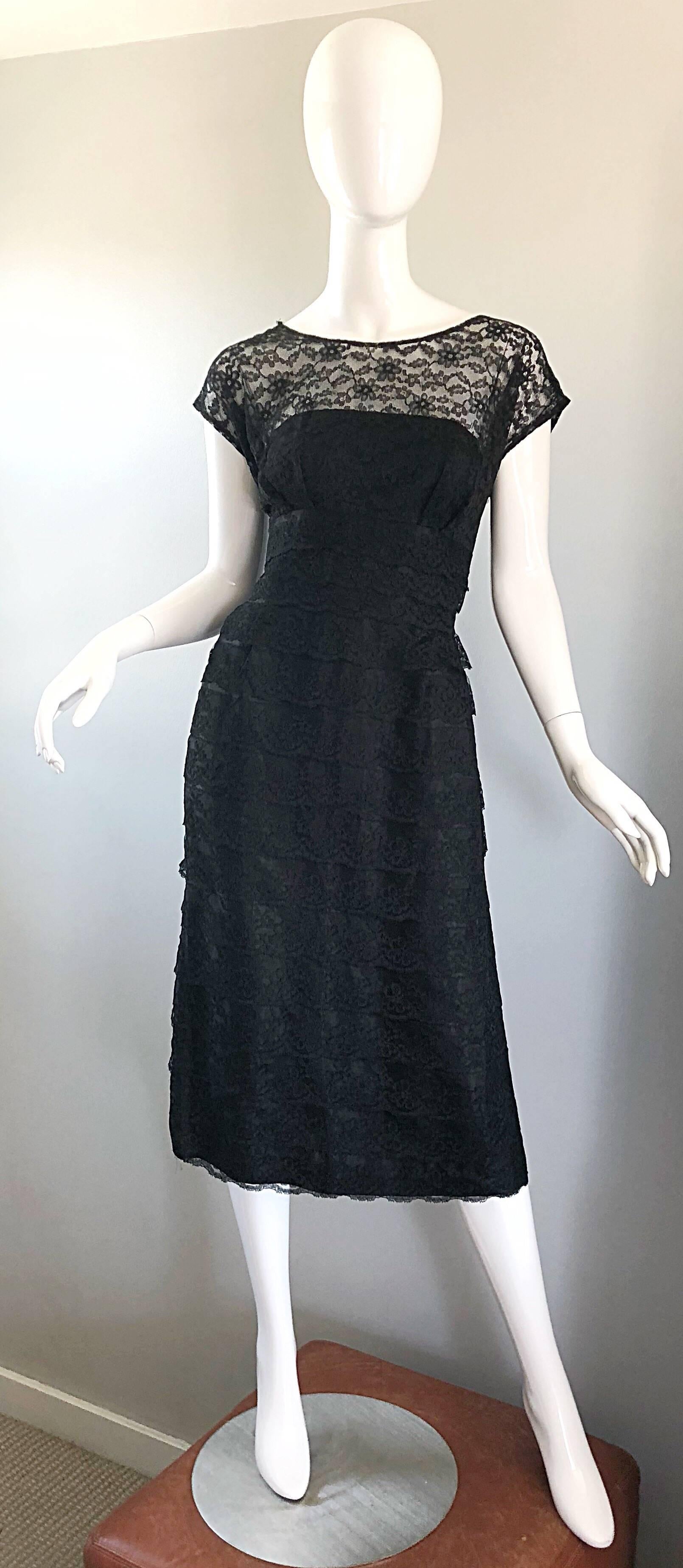 Chic 1950s black French lace cocktail dress! Features luxurious black French lace, with a fitted bodice and flattering forgiving skirt. Full metal zipper with hook-and-eye closure. Couture quality, with heavy attention to detail. The perfect classic