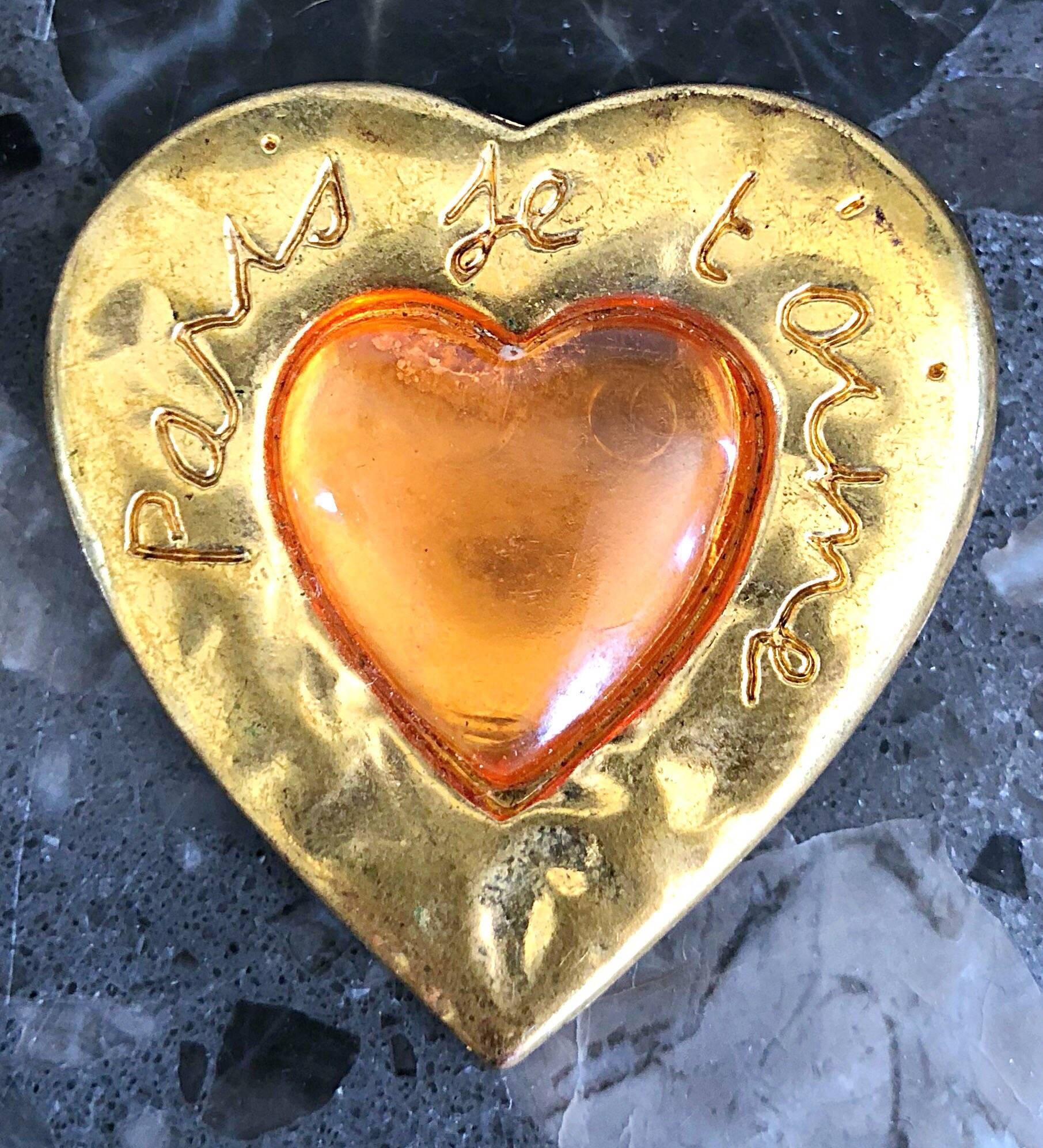 Chic vintage Yves Saint Laurent 'Paris Je T'aime' 
(translates I Love Paris) heart shaped hammered gold and amber gripoix brooch pin! Really adds just the right amount of punch to any outfit. A true classic piece of YSL history! In great