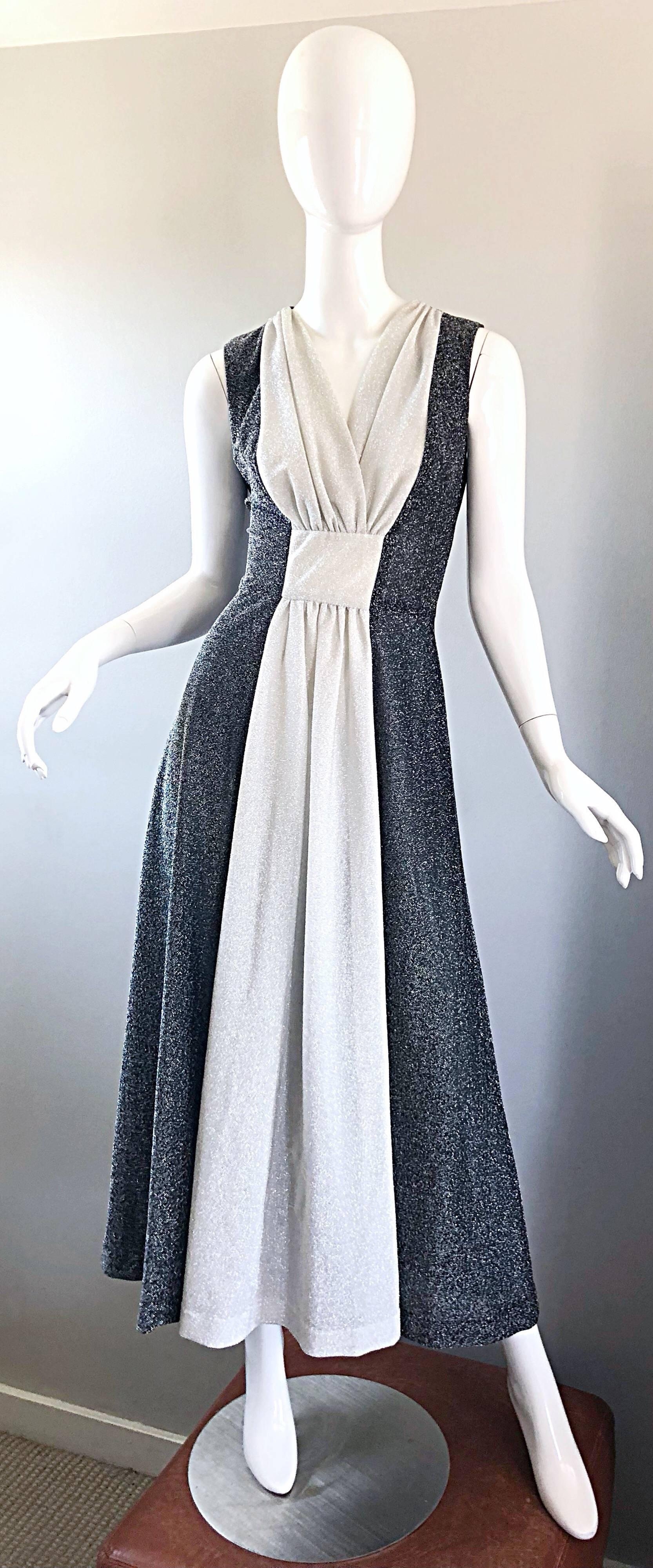 Amazing vintage 1970s gunmetal gray and silver metallic lurex maxi dress / Grecian gown! Features gunmetal metallic color blocking, with a silver metallic panel down the center. Flattering gathering detail at bust and waist. Full metal zipper up the