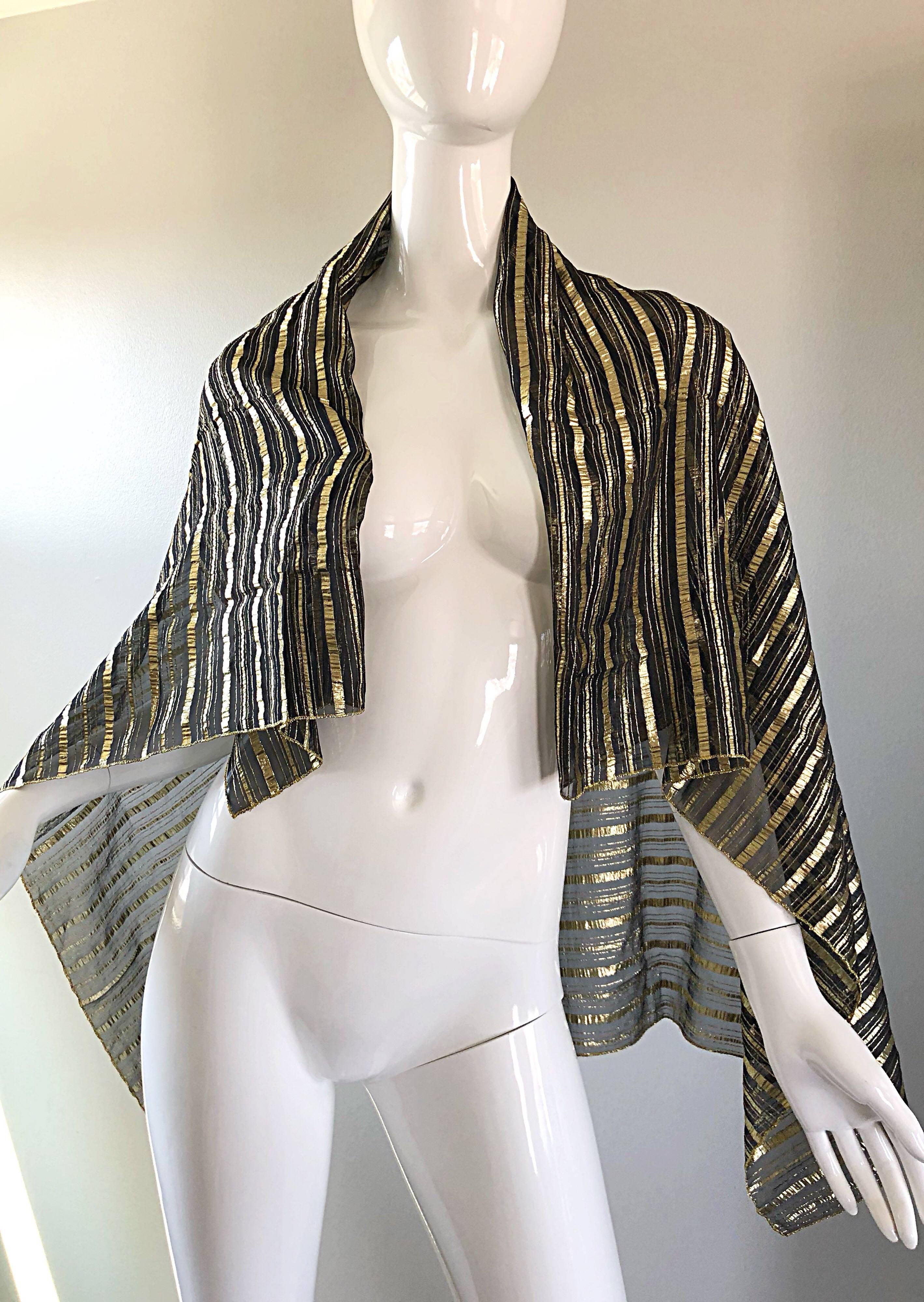 Beautiful vintage CHRISTIAN DIOR large gold and black silk metallic piano shawl scarf! Features gold and black metallic stripes throughout. Can be worn a number of different ways. Glamorous draped over the shoulders, or thrown over the neck. In