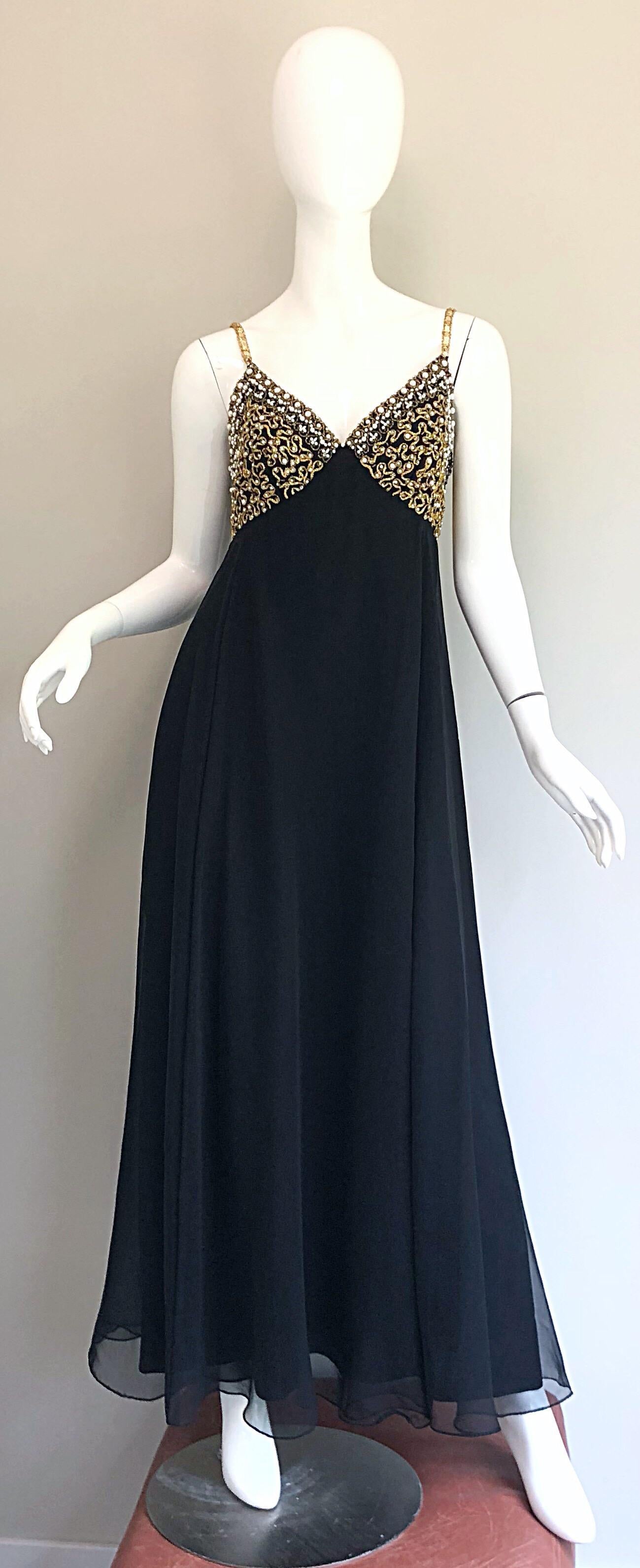 Gorgeous vintage 70s black and gold chiffon evening gown! Features a fitted bodice with spaghetti straps encrusted with gold sequins on each strap. Hundreds of hand-sewn pearls, sequins, rhinestones and beads on the front and back of the bodice.