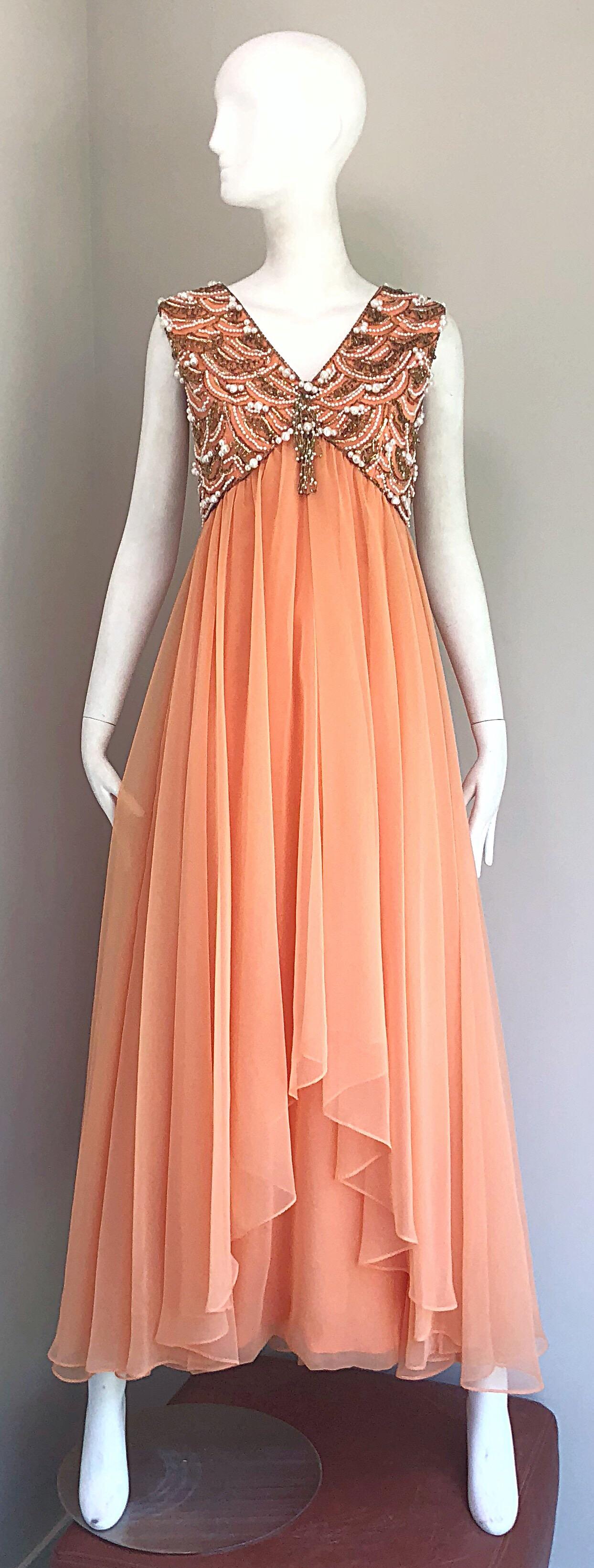 Stunning vintage 60s ISABELL GERHART of Houston 
sherbet / coral pink colored chiffon beaded sleeveless evening gown! Fitted beaded bodice, with layers and layers of luxurious chiffon that form a free flowing casculating hem at front center and