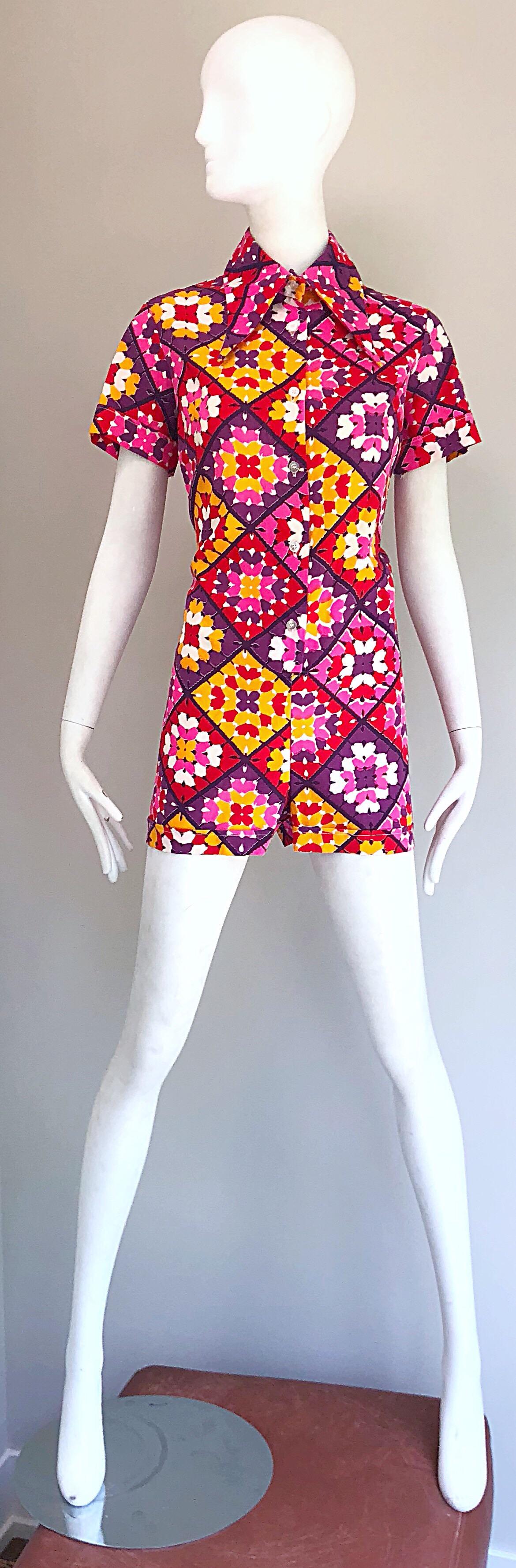 Amazing 1970s new with tags ( deadstock ) kaleidoscope hearts and flowers print one piece hot pants romper / jumpsuit! Features a symmetrical kaleidoscope print in vibrant colors of hot pink, fuchsia, purple, marigold yellow, and red. Buttons up the