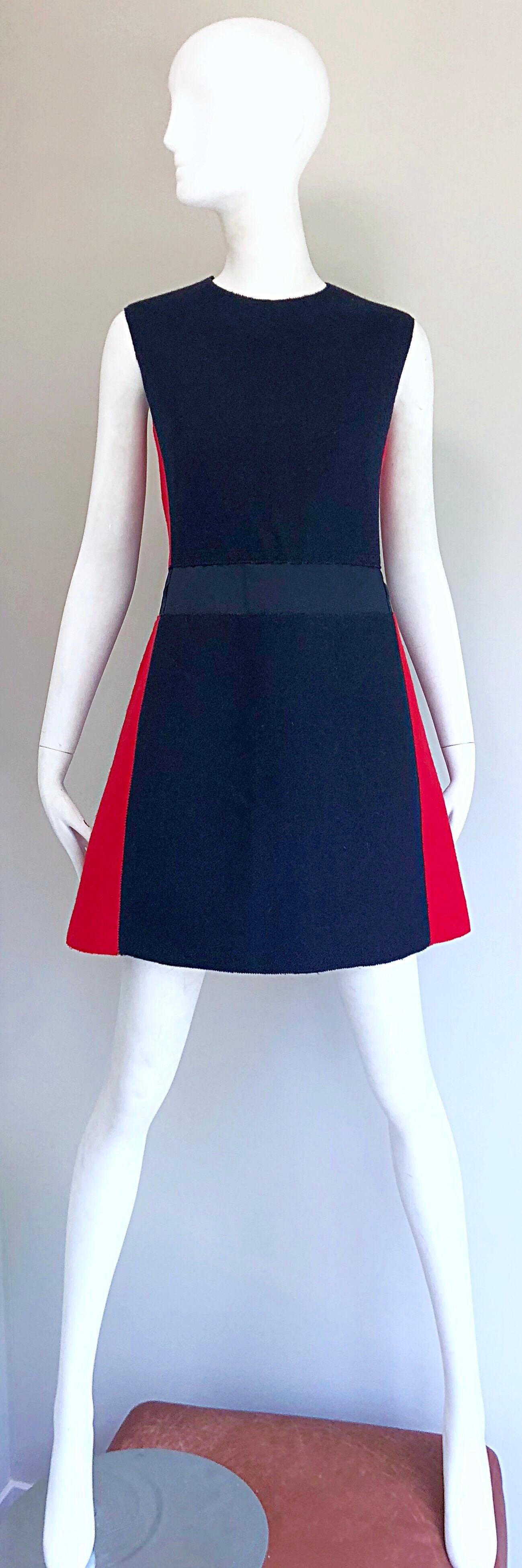 Incredibly chic early 2000s does 1960s MIU MIU navy blue and red color block A - Line nautical dress! Features soft virgin wool. Sleek tailored bodice with a flattering A-Line skirt. Hidden zipper up the back with hoo-and-eye closure. Great to go