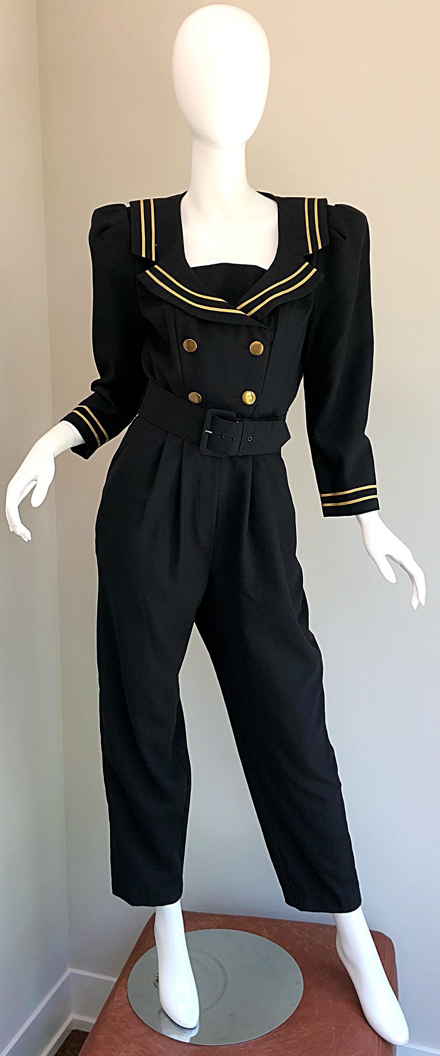 Incredible vintage nautical belted jumpsuit! Soft black rayon blend fabric. Double breasted style it's muted gold buttons up the front. Shelf bust attaches to interior buttons, and can be worn with or without. Strong shoulders, with shoulder pads