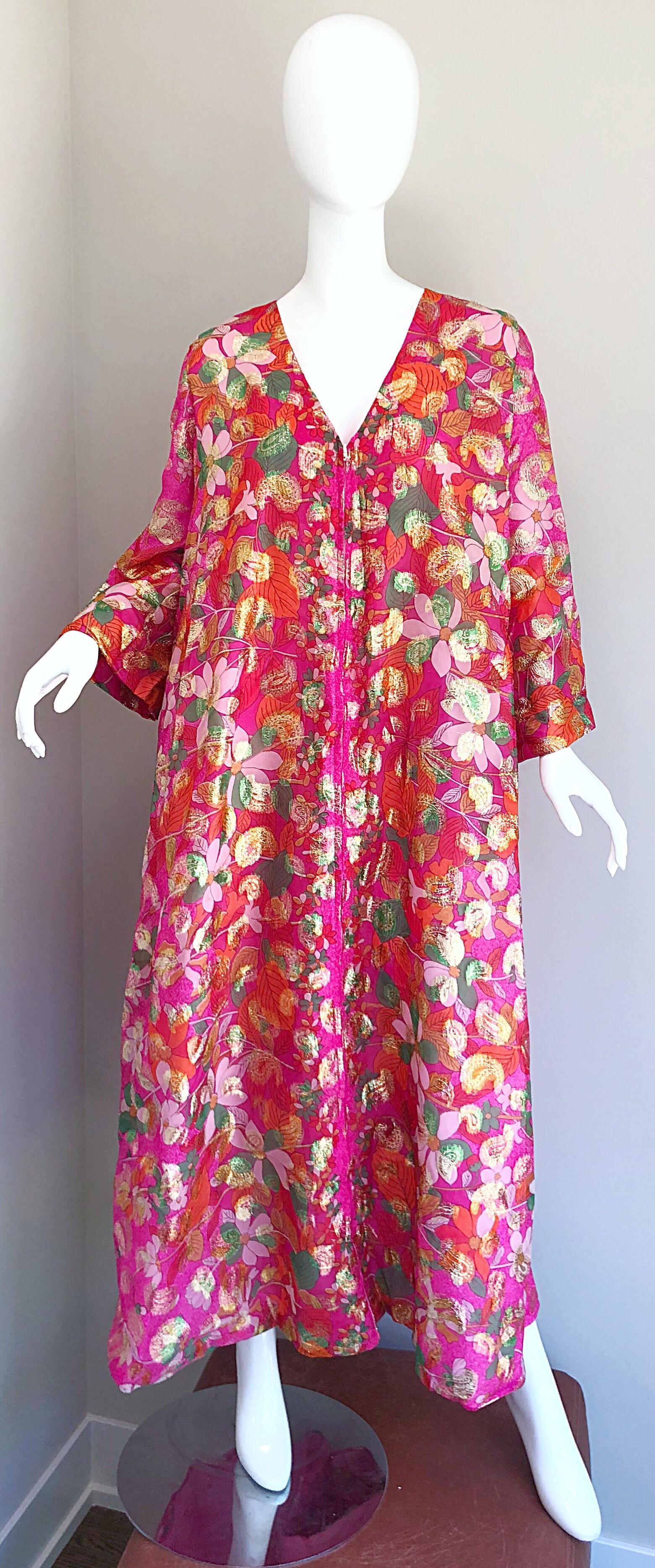 Incredible 70s vintage SAKS FIFTH AVENUE chiffon hot pink and gold kaftan! Features flowers and paisley prints throughout. Vibrant hot pink background, and colorful pops of green, turquoise blue, orange, fuchsia, and purple throughout. Full hidden