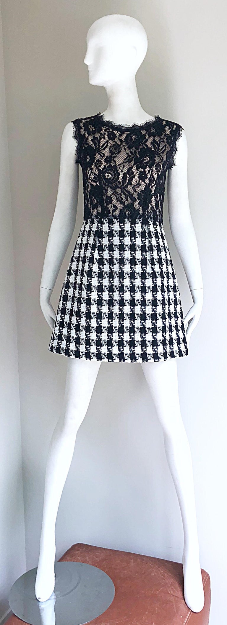 Insanely chic early 2000s MARC JACOBS black, white, and nude lace houndstooth mini dress! Features a black lace bodice with a nude underlay. Black and white houndstooth slightly flared skirt. Hidden zipper up the back with hook-and-eye closure. In