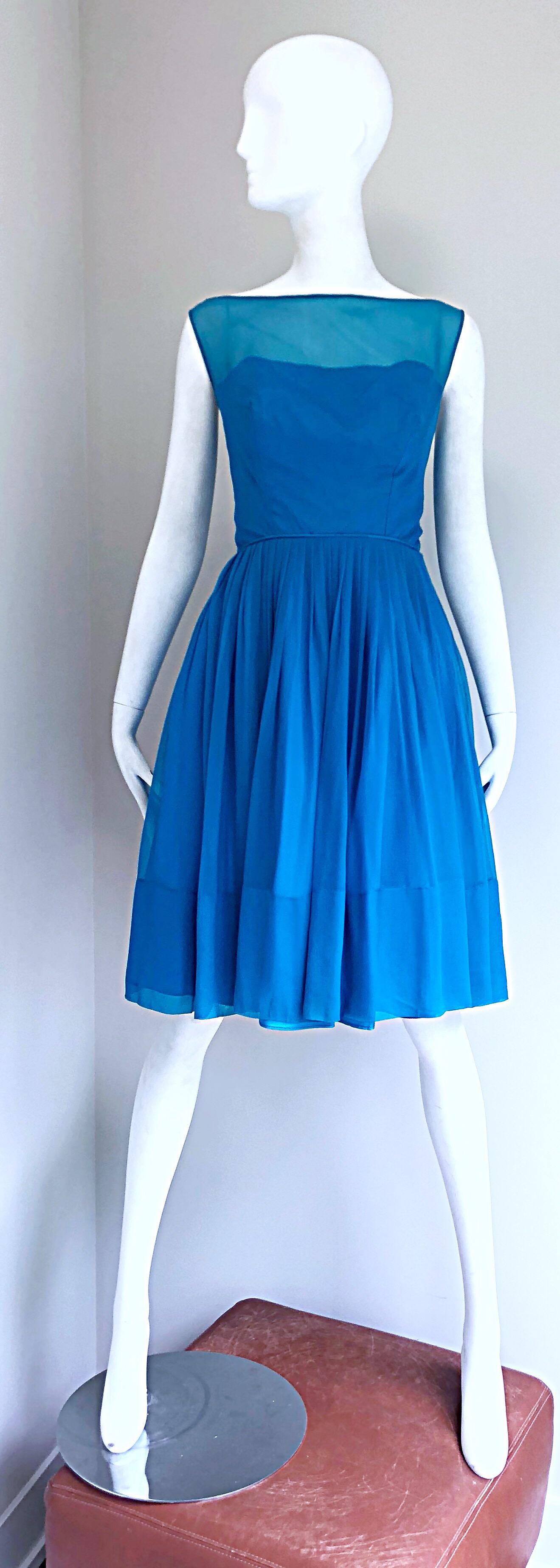 Beautiful 1950s turquoise blue nude illusion silk chiffon fit and flare cocktail dress! Vibrant turquoise blue color. Fitted bodice with a taffeta underlay and chiffon overlay. Full metal zipper up the back with hook-and-eye closure. Three spaghetti