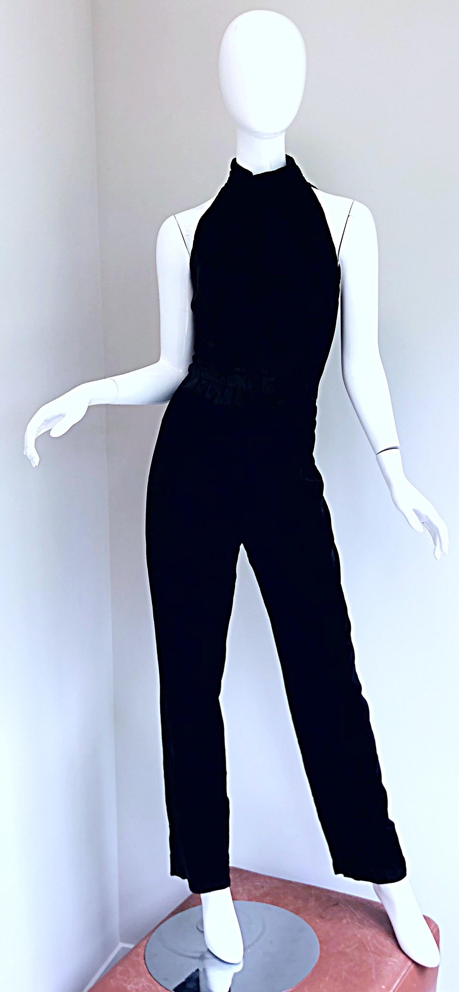 Amazing 1990s black silk velvet open-back jumpsuit! Features a soft luxurious silk velvet that feels fantastic on. Super flattering fit. Fitted bodice and a relaxed leg. Open back reveals just the right amount of skin. Hidden zipper up the back with