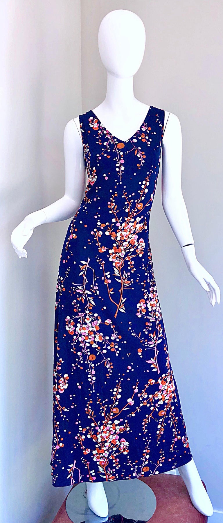 Amazing 1970s navy blue, pink, orange and white jersey maxi dress and shirt jacket! Features a fun olive branch novelty print thorughout. Dress has a hidden zipper up the back. Shirt has buttons up the front, and can either be worn buttoned or tied