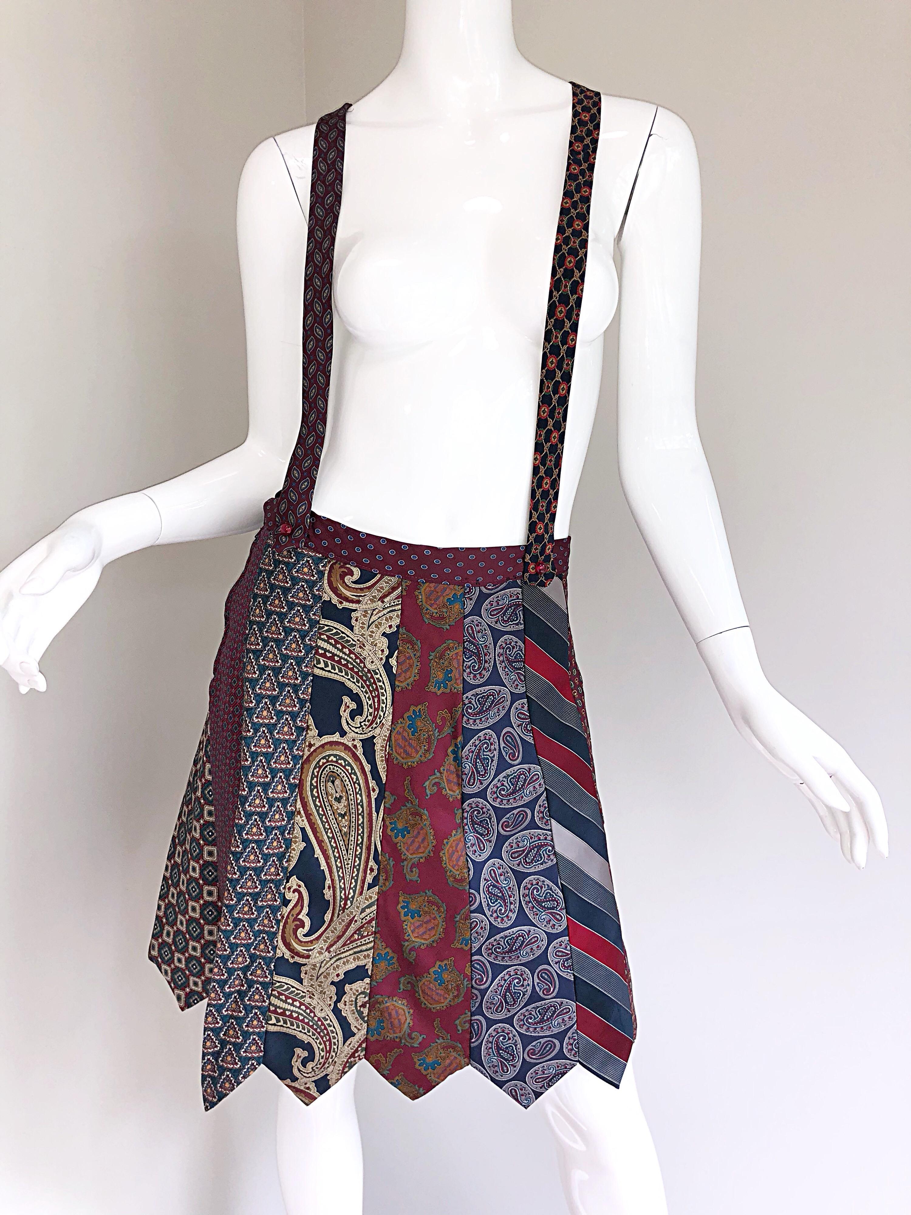 Incredible vintage skirt made entirely of vintage silk neck ties! Features paisley, polka dots, stripes etc. on each tie. Attached suspenders with a racerback. Sits low on the waist. Buttons at side waist. A real statement maker! Very well made,