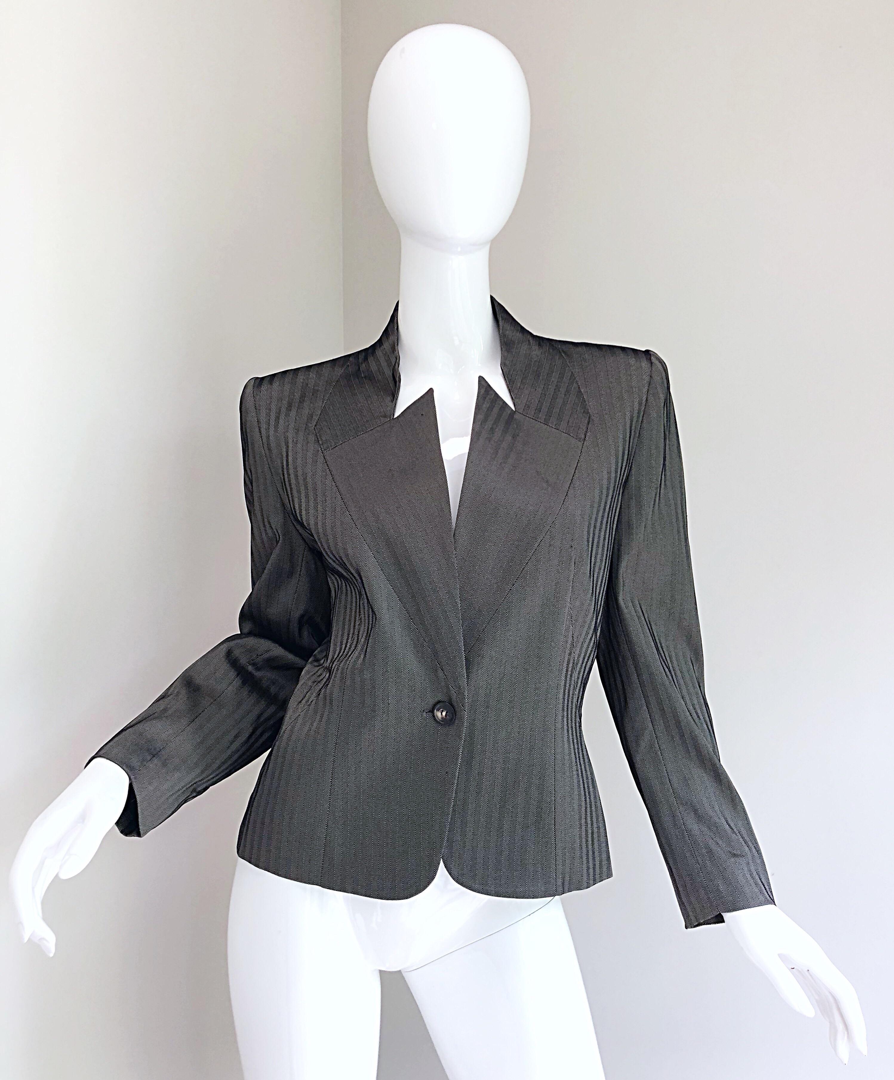 Amazing vintage 1990s GIVENCHY COUTURE by ALEXANDER MCQUEEN Avant Garde black and white herringbone silk blazer! Features an allover Herringbone print, with a unique bold futuristic neckline. Tailored fit looks amazing on! Single button closure.