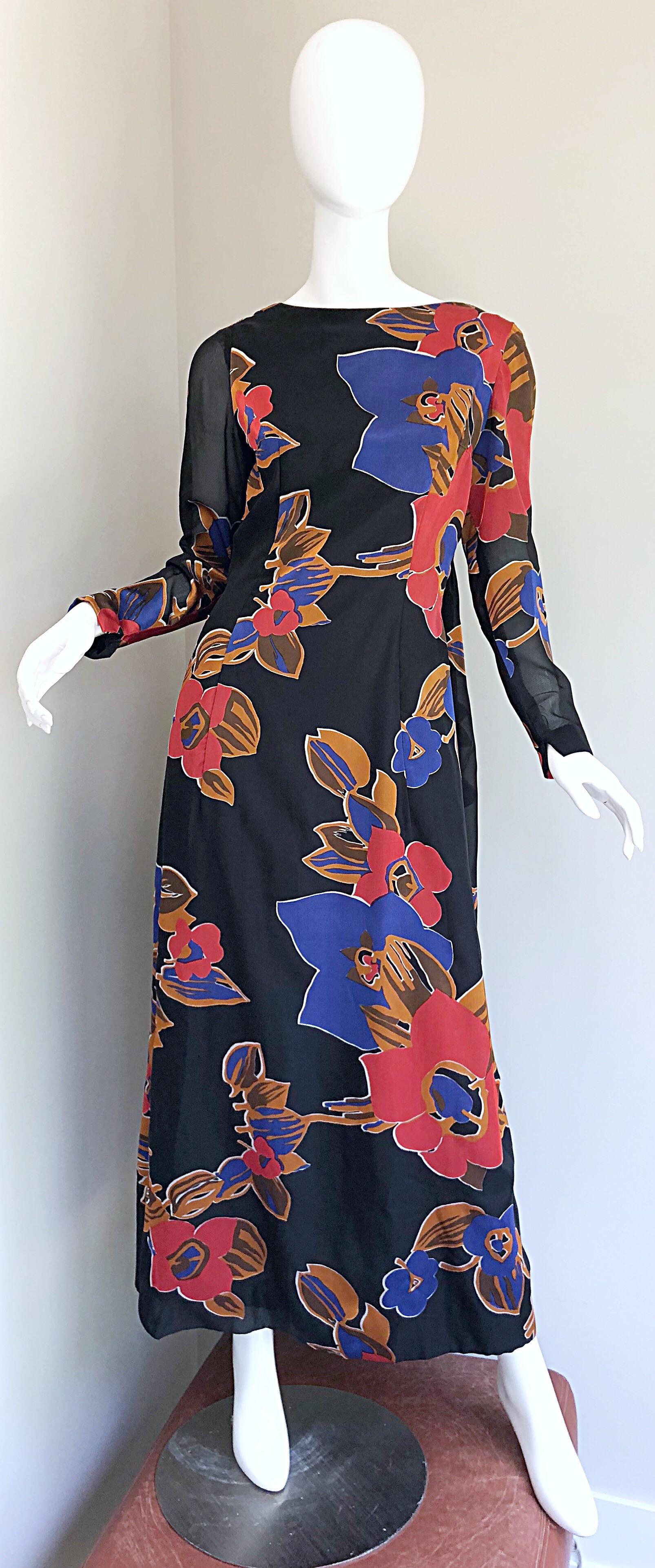 Fabulous 1960s JOHN BOYLE BISHOP black, red and terra cotta brown silk trained gown! Features an elegant high neck with a dramatic cape-like train in the back. Semi sheer patterned sleeves. Full metal zipper up the back with hook-and-eye closure.