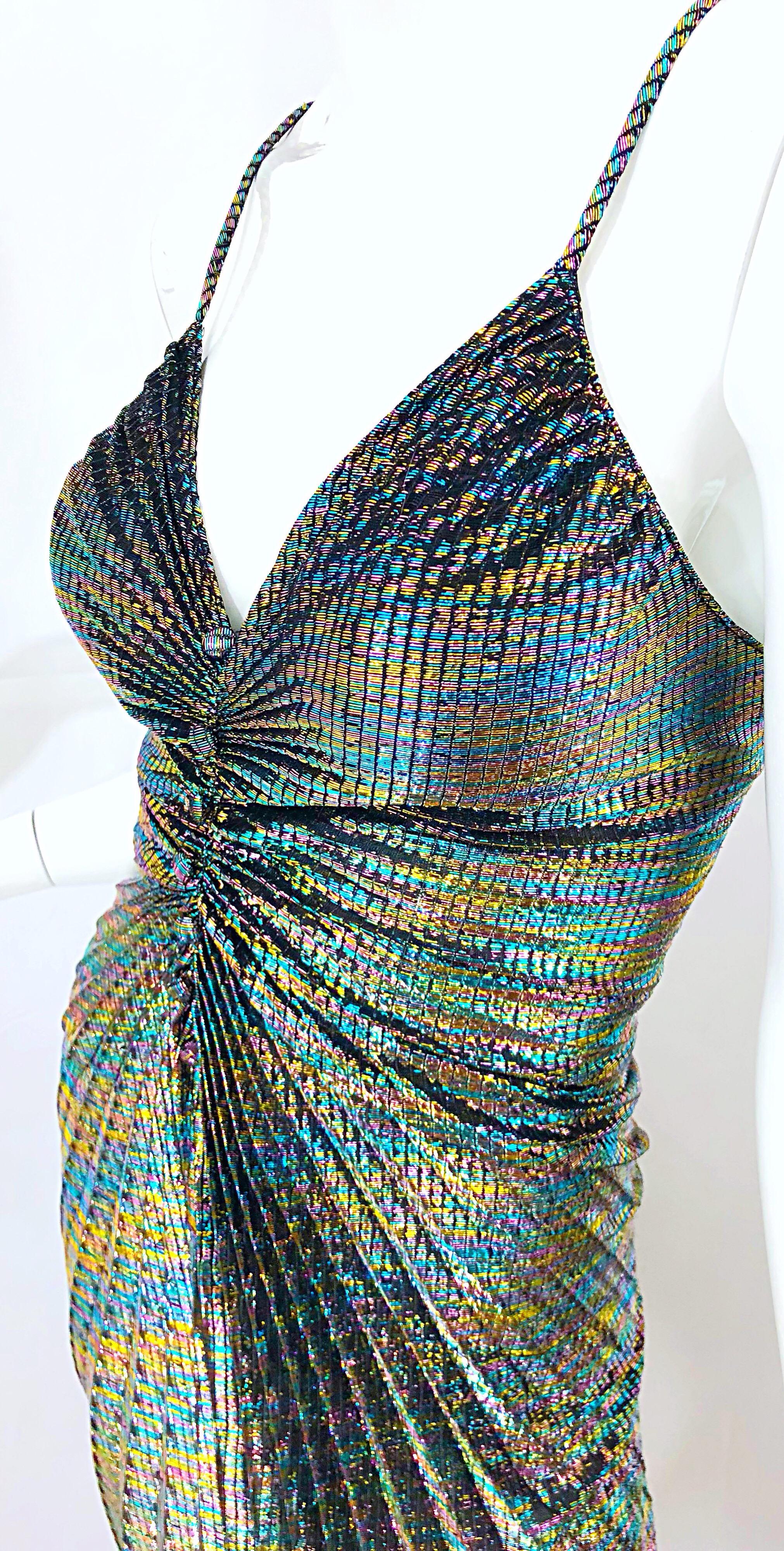 Amazing 1970s SAMIR rainbow metallic pleated slinky sleeveless disco dress! Features a rainbow of colors throughout. Hidden zipper up the back. Channel your inner Studio 54 diva in this sexy number! Great with heels or boots. 
In great condition.