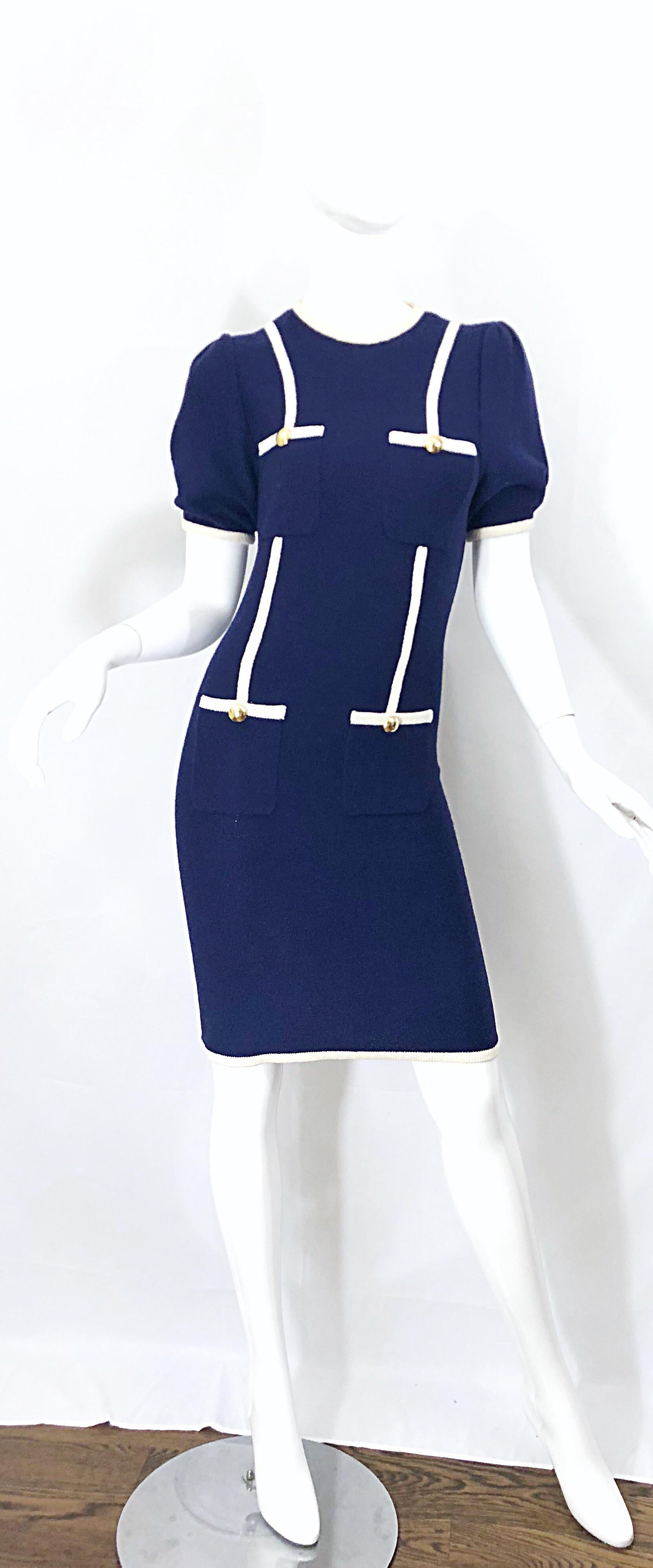 Chic vintage ADOLFO for SAKS FIFTH AVE. navy blue and white nautical knit dress! Soft knit fabric stretches to fit. Four pockets on the front with shiny gold buttons. Hidden zipper up the back with hook-and-eye closure. Very well made, with lots of