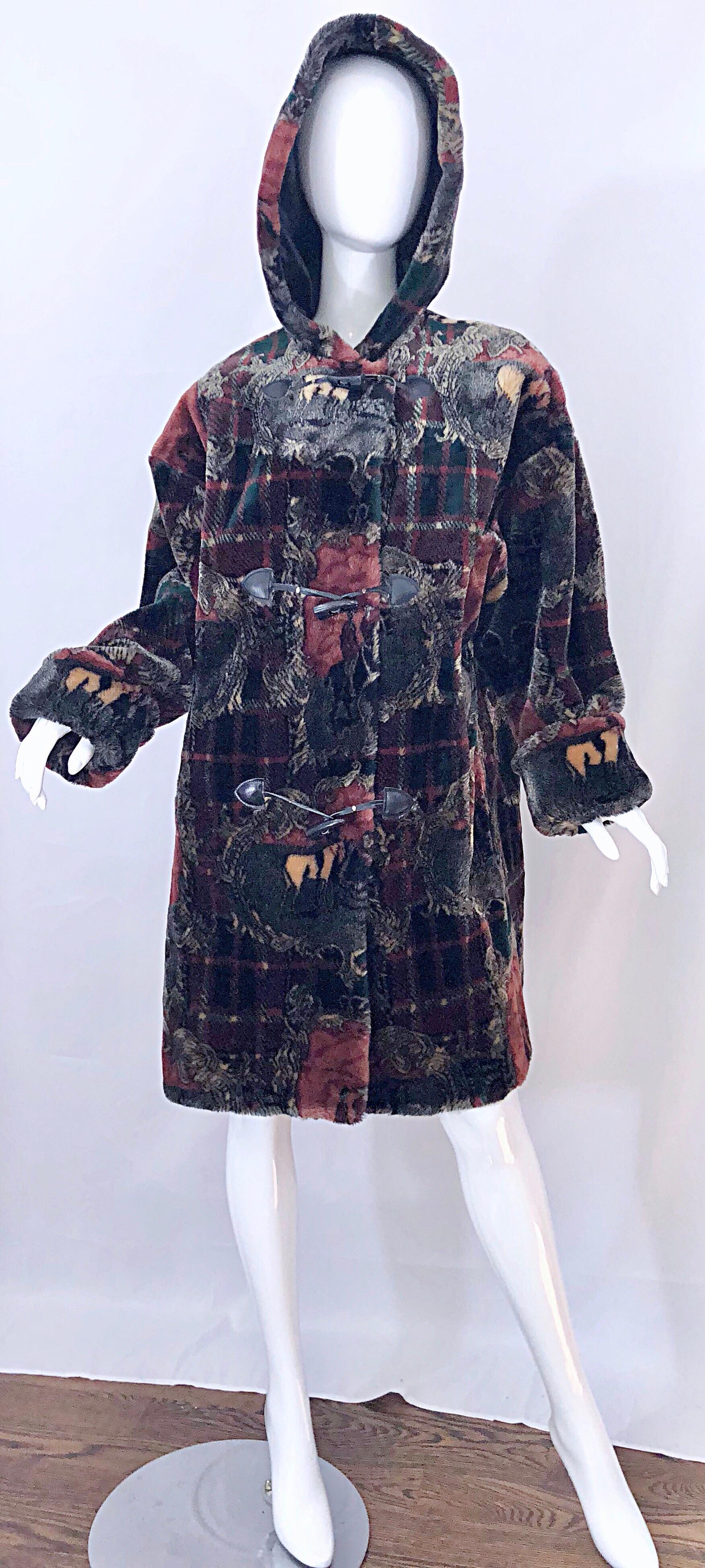 Amazing vintage Donnybrook equestrian print plaid oversized faux fur hooded jacket coat! Features horses and riders with tartan plaid throughout. Attached hood can be worn down or up for extra chilly weather. Pockets at each side of the hips. Toggle
