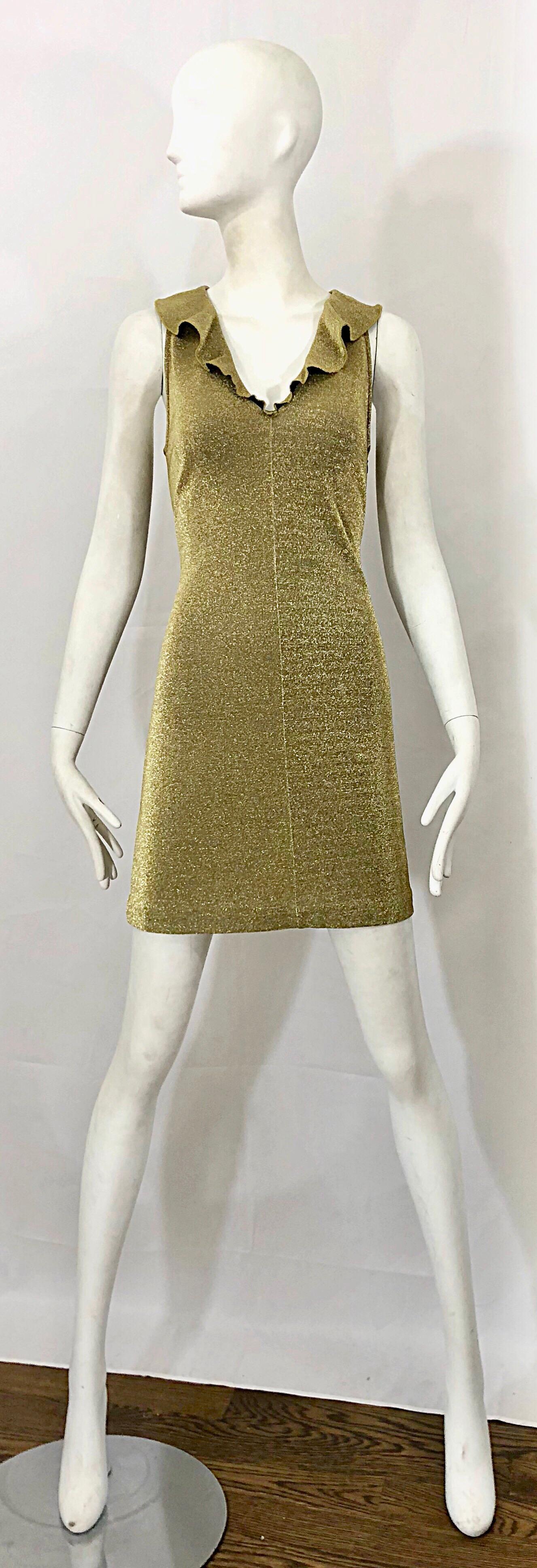 Sexy 1990s MARGANO Italian made gold metallic jersey bodycon dress! Features a luxurious gold jersey that stretches to fit. Flirty ruffle collar. Great alone or belted. The pictured black velvet Yves Saint Laurent YSL is also available in my 1stdibs