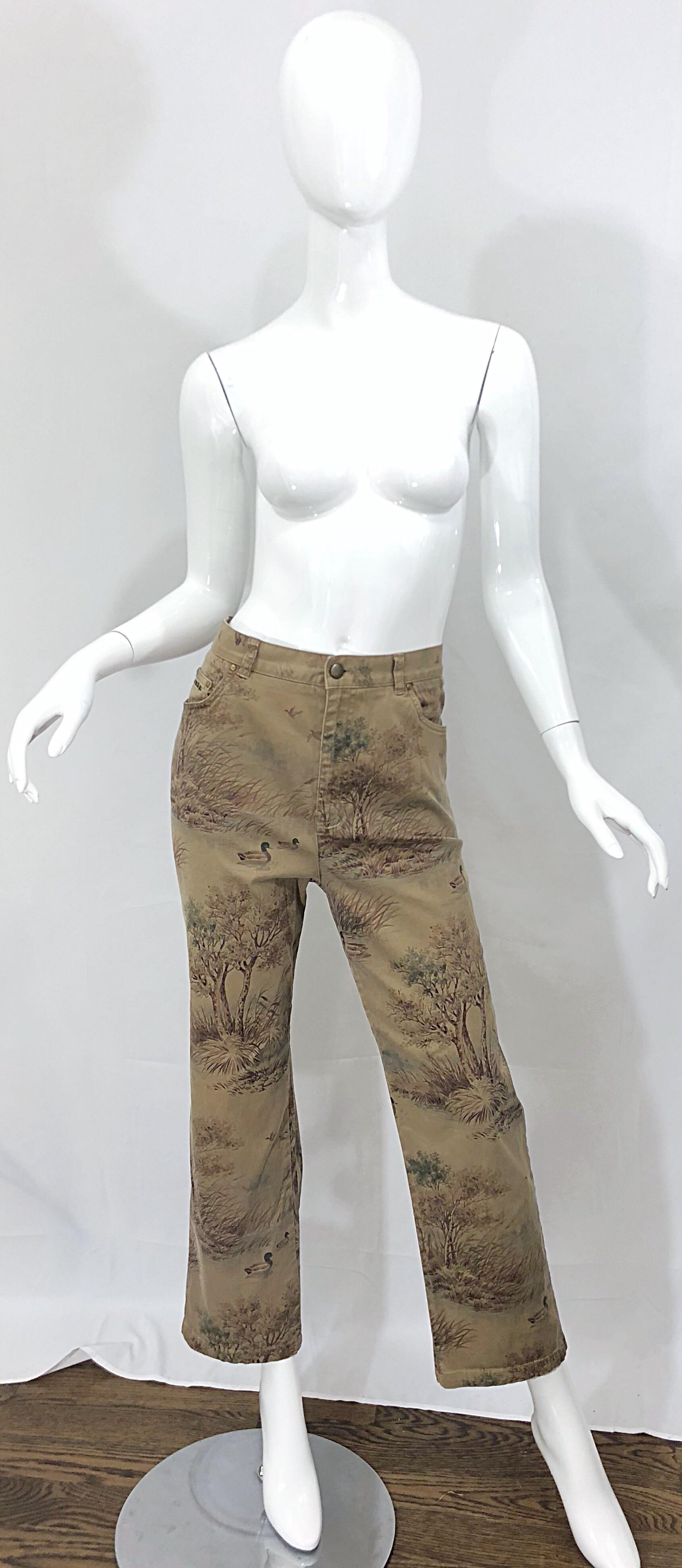 Rare vintage mid 90s RALPH LAUREN Size 14 camouflage high waisted tailored trousers! Features a tan / light brown backdrop with darker colors of brown and green. Sitting and flying ducks printed throughout. High waist fit with slim fitting legs that