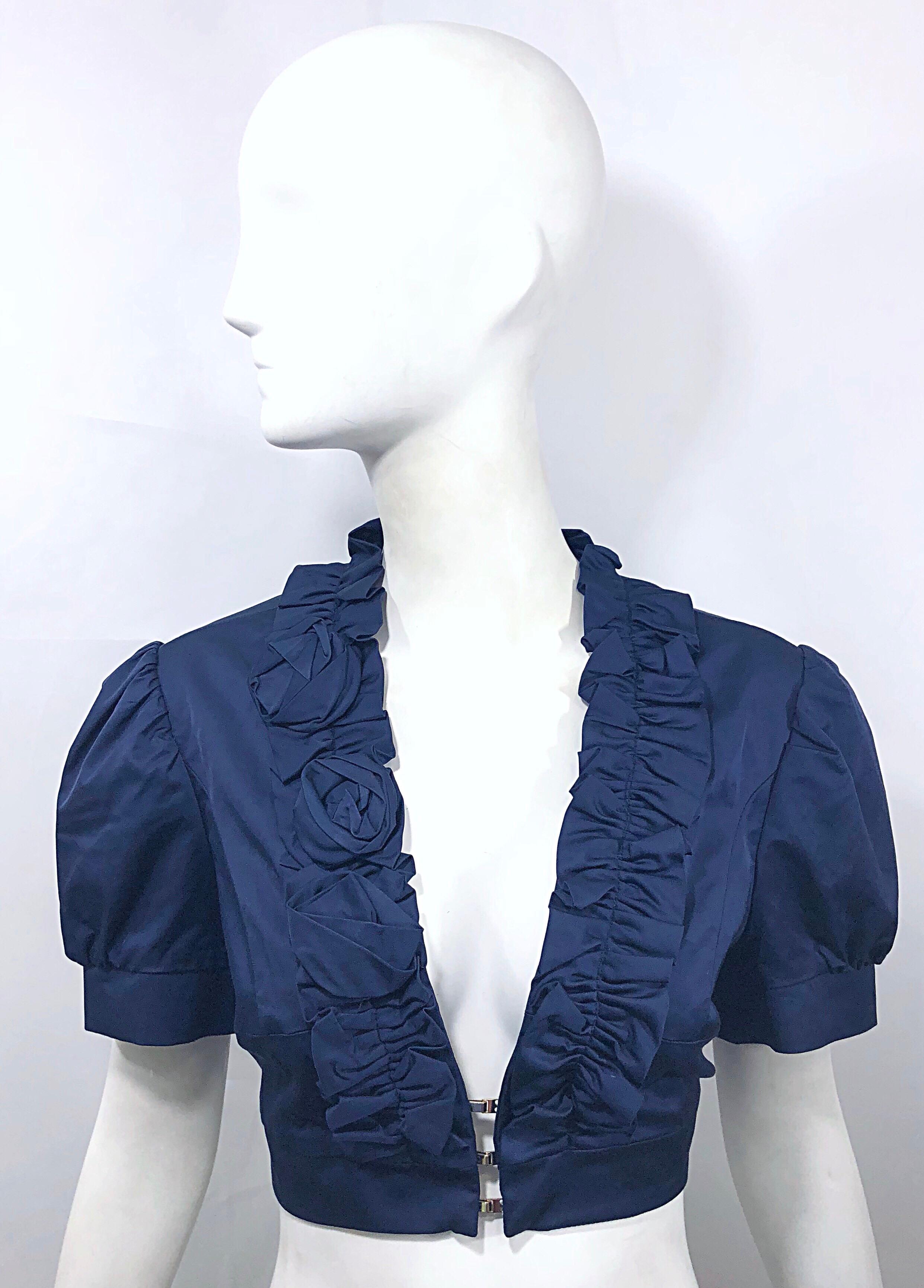 New FLAVIO CASTELLANI 2000s navy blue cropped short sleeve top / jacket ! Features a luxurious fabric blend of Viscose (50%), Cotton (45%), and Spandex (5%) that has some stretch. Three silver hook-and-eye closures on front center. Rosette details