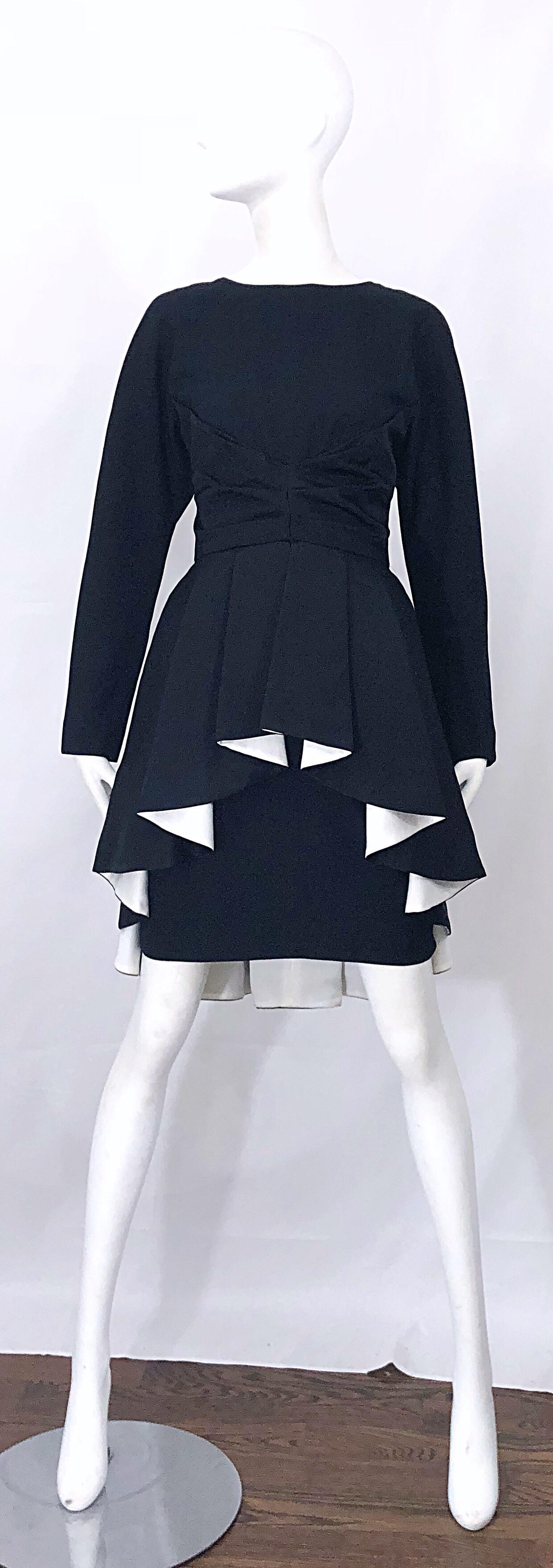 Rare early 1990s JOAN RAINES black and white Avant Garde long sleeve dress! Joan Raines was the daughter of famed designer Adele Simpson, and followed in her mother's footsteps in the late 80s / early 90s. 
This beauty features so much intricate