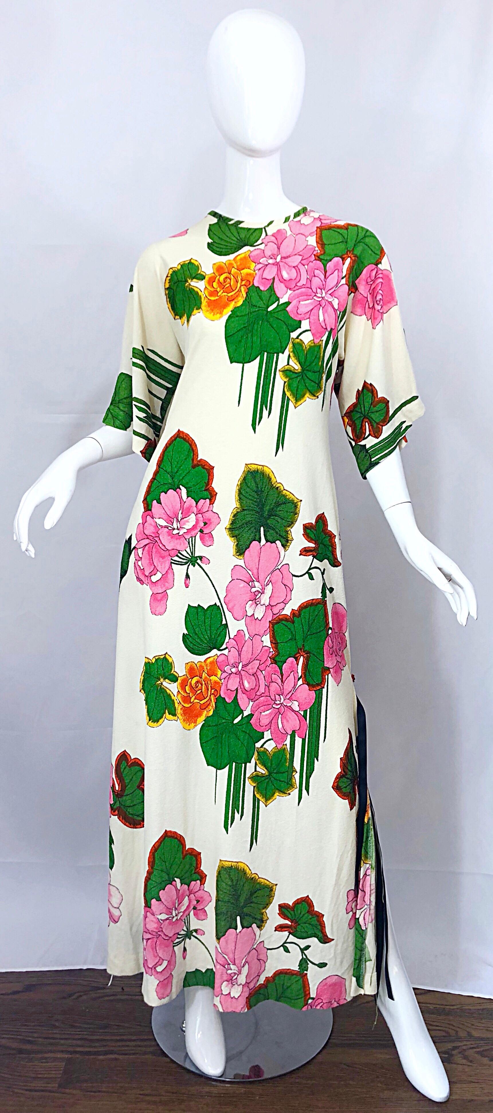 Awesome 70s does 30s terry cloth Hawaiian flower print fringed maxi dress! Features a super soft terry cloth fabric that stretches to fit. Vibrant colors of pink, hot pink, kelly green, orange and yellow on an ivory backdrop. Slits at both sides of