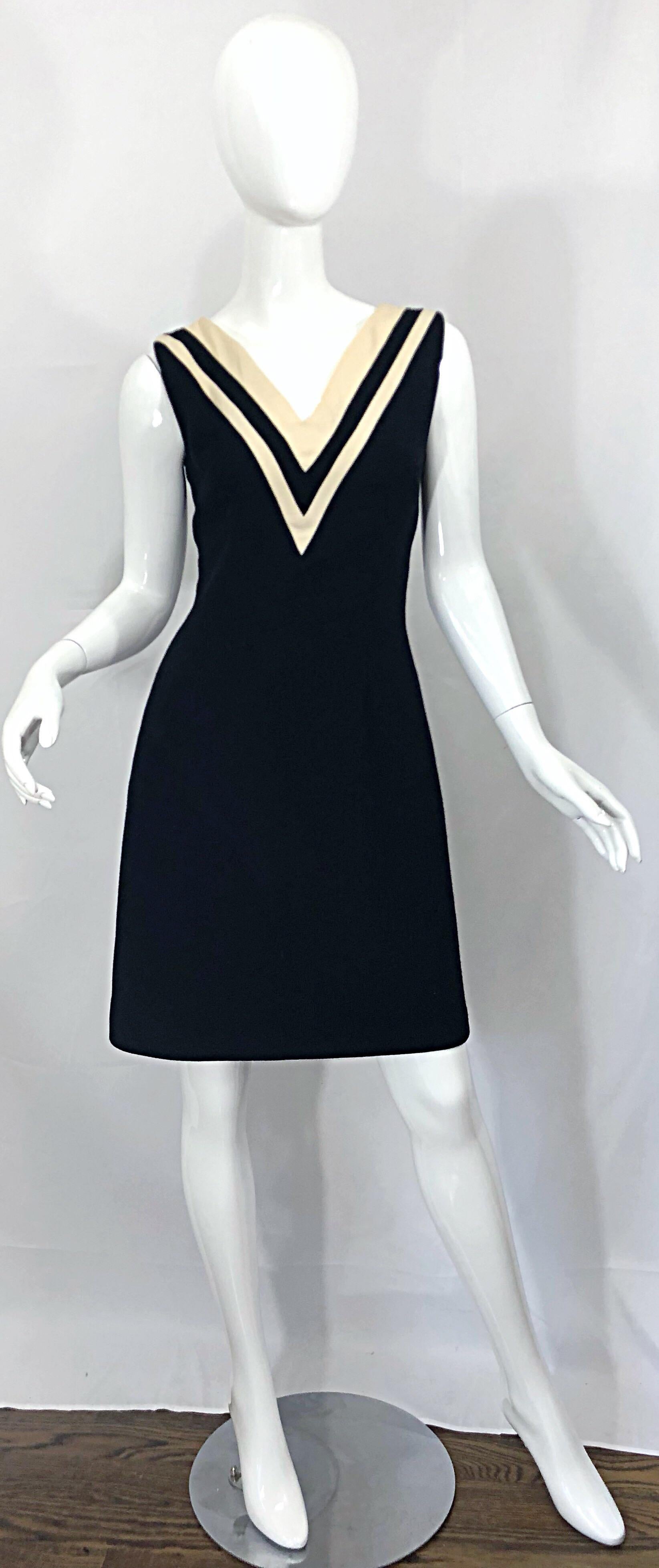 Classic vintage 90s DOLCE & GABBANA black and ivory white virgin wool shift dress! Features a super soft virgin wool with a silk lining. Fitted bodice with a forgiving flattering skirt. The perfect little black dress with just the right amount of