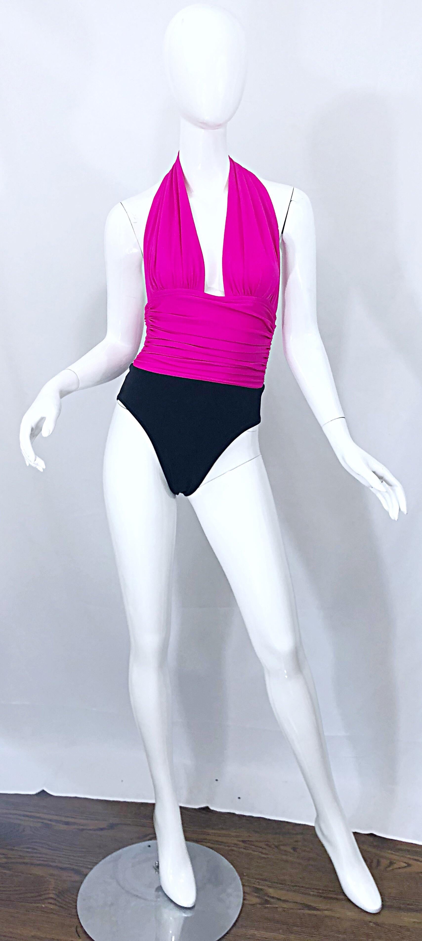 Sexy vintage YVES SAINT LAURENT hot pink and black plunging halter one piece swimsuit or bodysuit! Features a flattering ruched bodice with a plunging neckline. Plastic clasp at top back neck. Very sexy and flattering. Perfect for the beach, pool,
