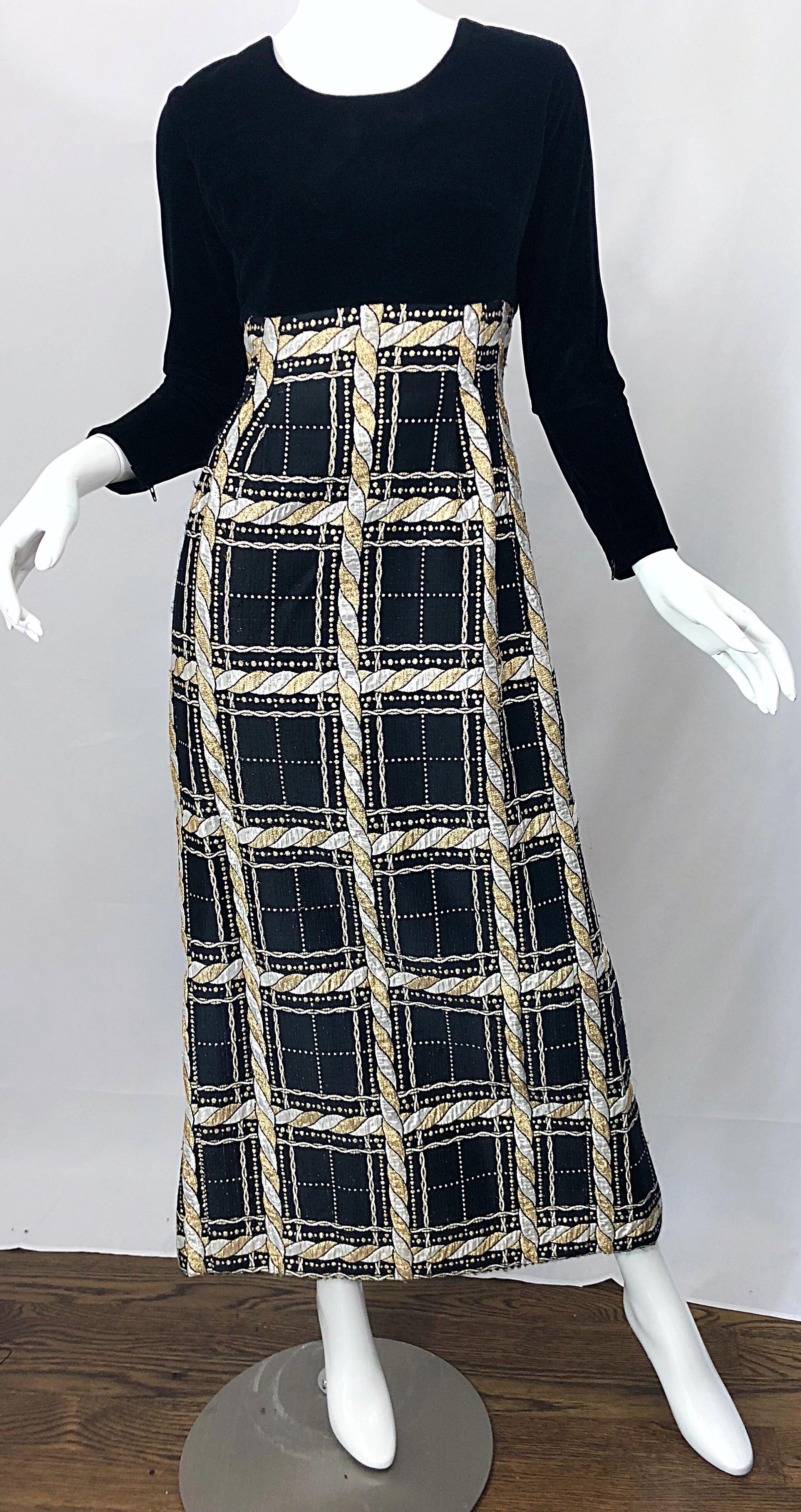 Incredible 1970s black, silver and gold velvet and lurex long sleeve metallic gown! Features a soft black rayon velvet tailored bodice with sleek long sleeves that feature a hidden zipper at each cuff. Regal plaid metallic lurex skirt features rope