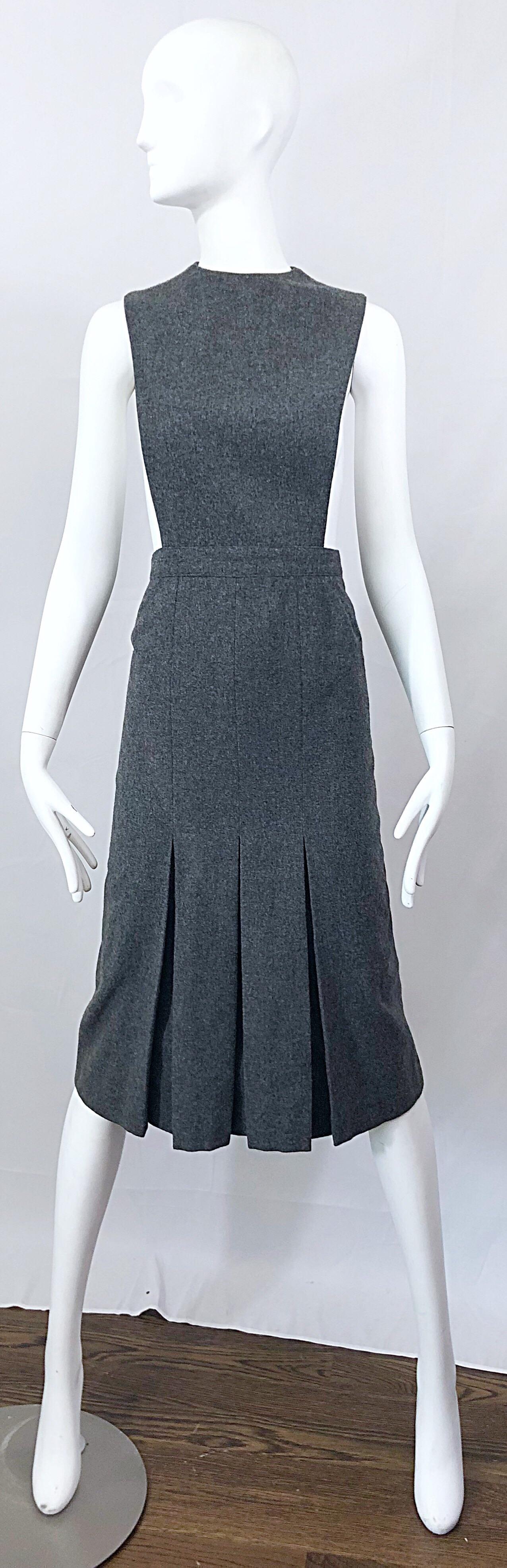 Insanely chic and collectible musuem worthy vintage 1960s PIERRE CARDIN Couture charcoal grey wool sideless dress! Features an optical illusion cut-out side that inspired Karl Lagerfeld to design the infamous dress for Chanel, worn by Keira