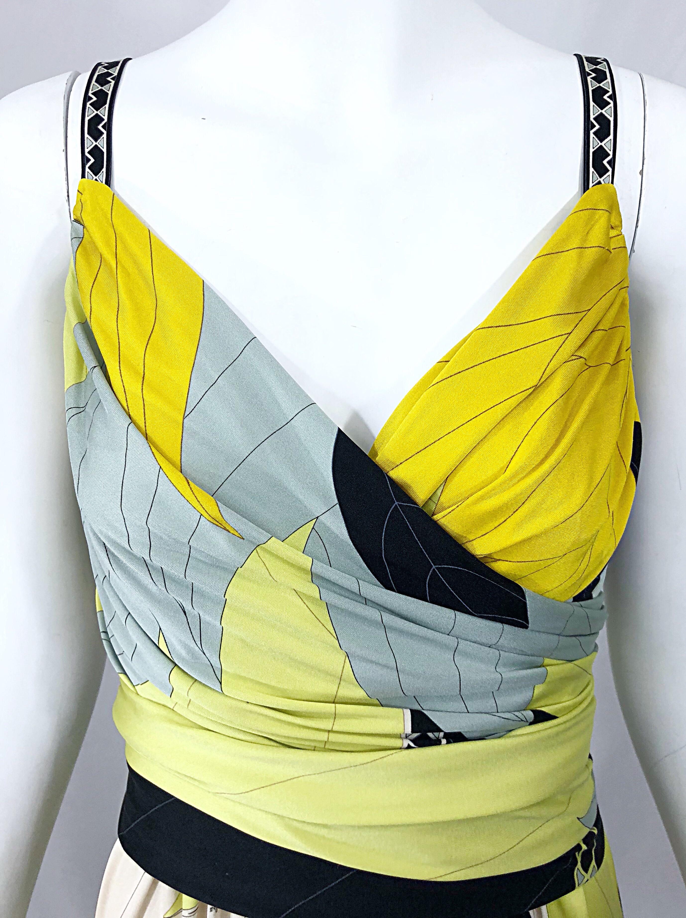 Wonderful vintage late 90s EMILIO PUCCI chartreuse green, yellow, blue and white silk jersey sleeveless dress! Features the brand's signature kaleidoscope print with signature throughout. Detachable matching belt buttons on the back. Hidden zipper