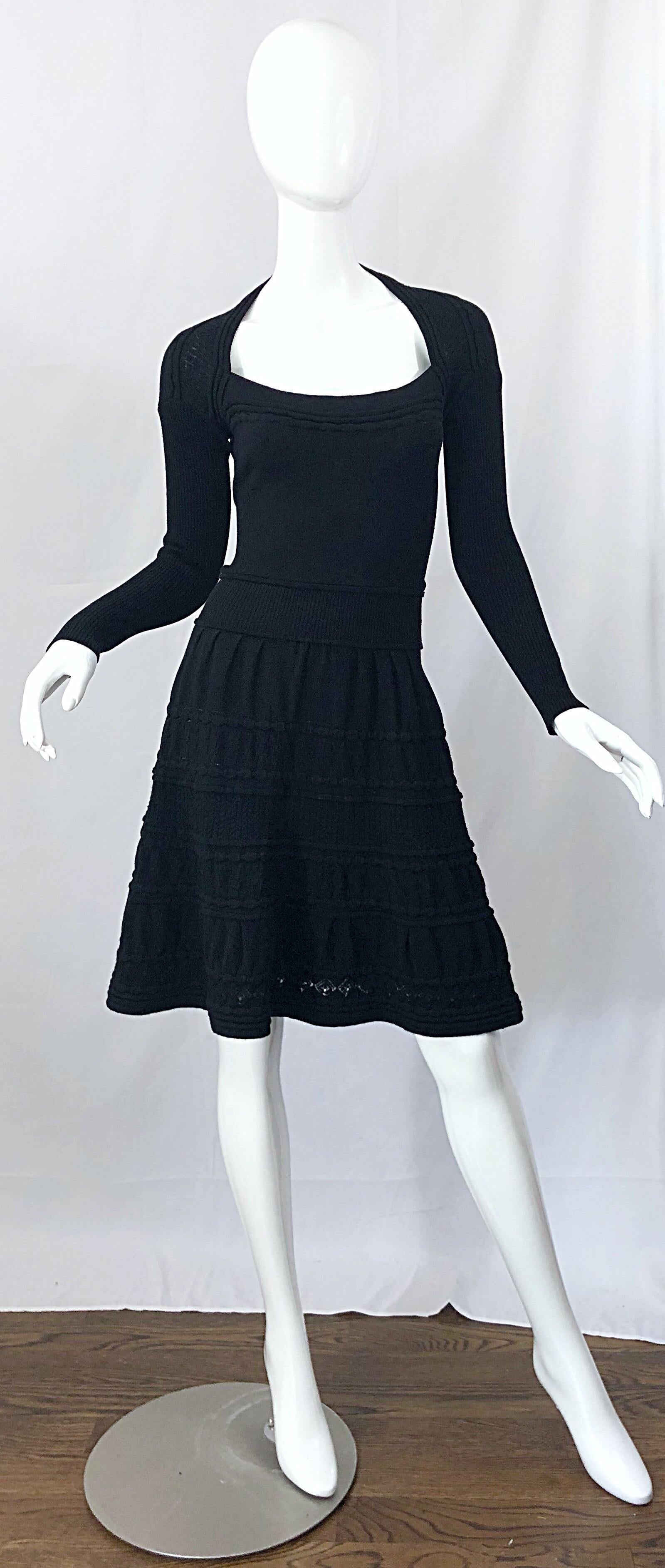 Brand new with tags D. EXTERIOR Italian made black crochet lightweight wool long sleeve skater dress! Super soft lightweight Italian wool that stretches to fit. 
Features a scoop neck bodice with sleek long sleeves and a tailored bodice. Flattering