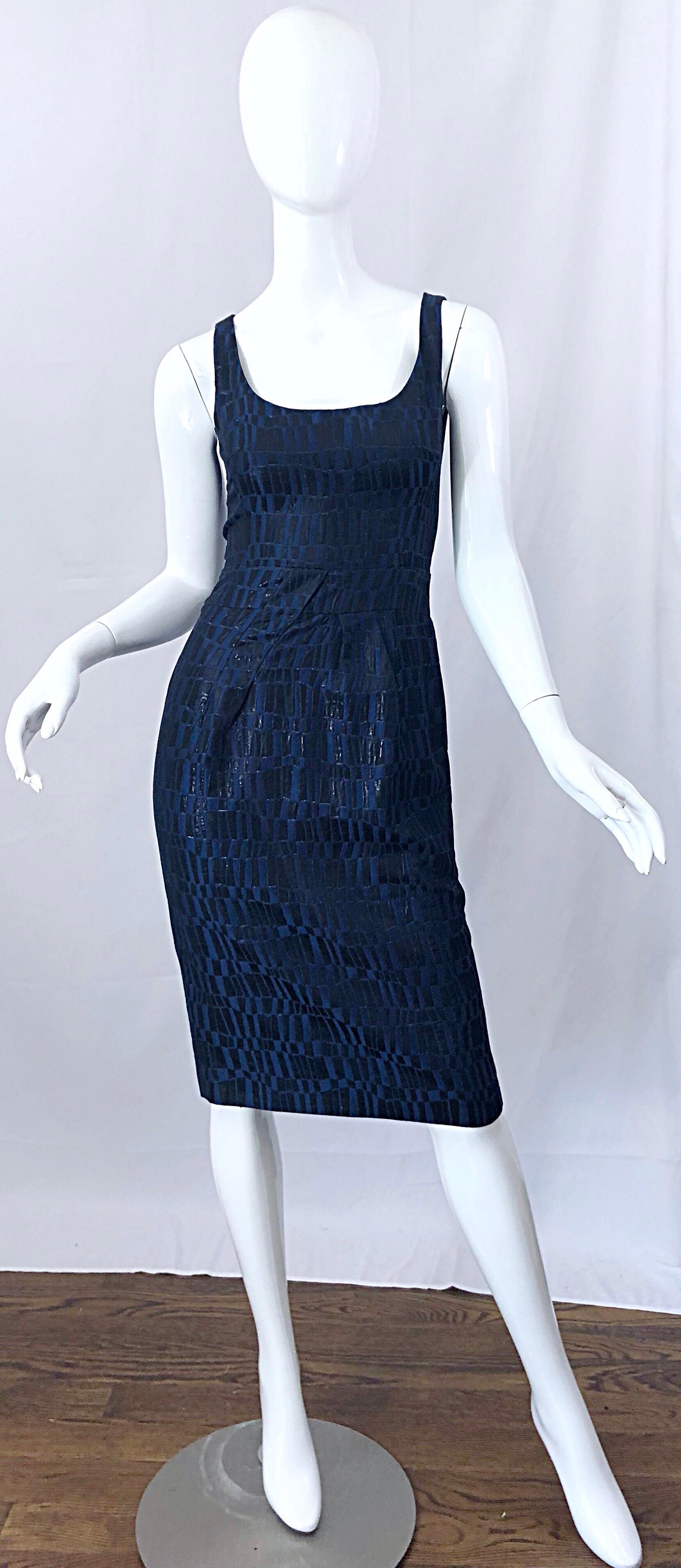 Chic and classic MICHAEL KORS COLLECTION navy blue and black metallic sheath dress. Flattering abstract geometric shapes throughout. Features Kors' signature lines and tailoring that really do flatter a woman's body. Perfect for day or evening.