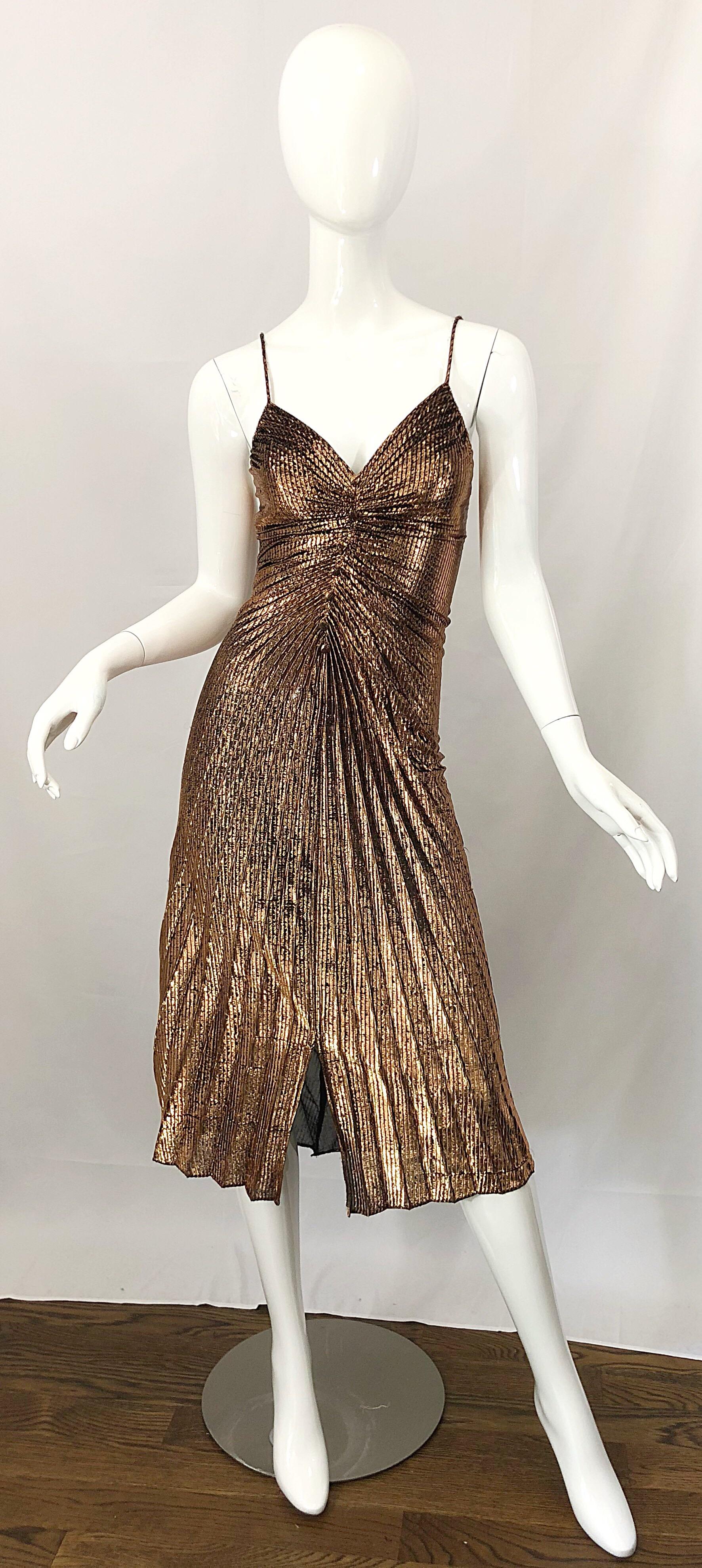 Sexy 1970s SAMIR gold / bronze metallic pleated slinky disco dress! I just love these dressed, and they are getting harder and harder to find, and always sell almost immediately! Features a flattering pleated body, with mock fabric covered buttons