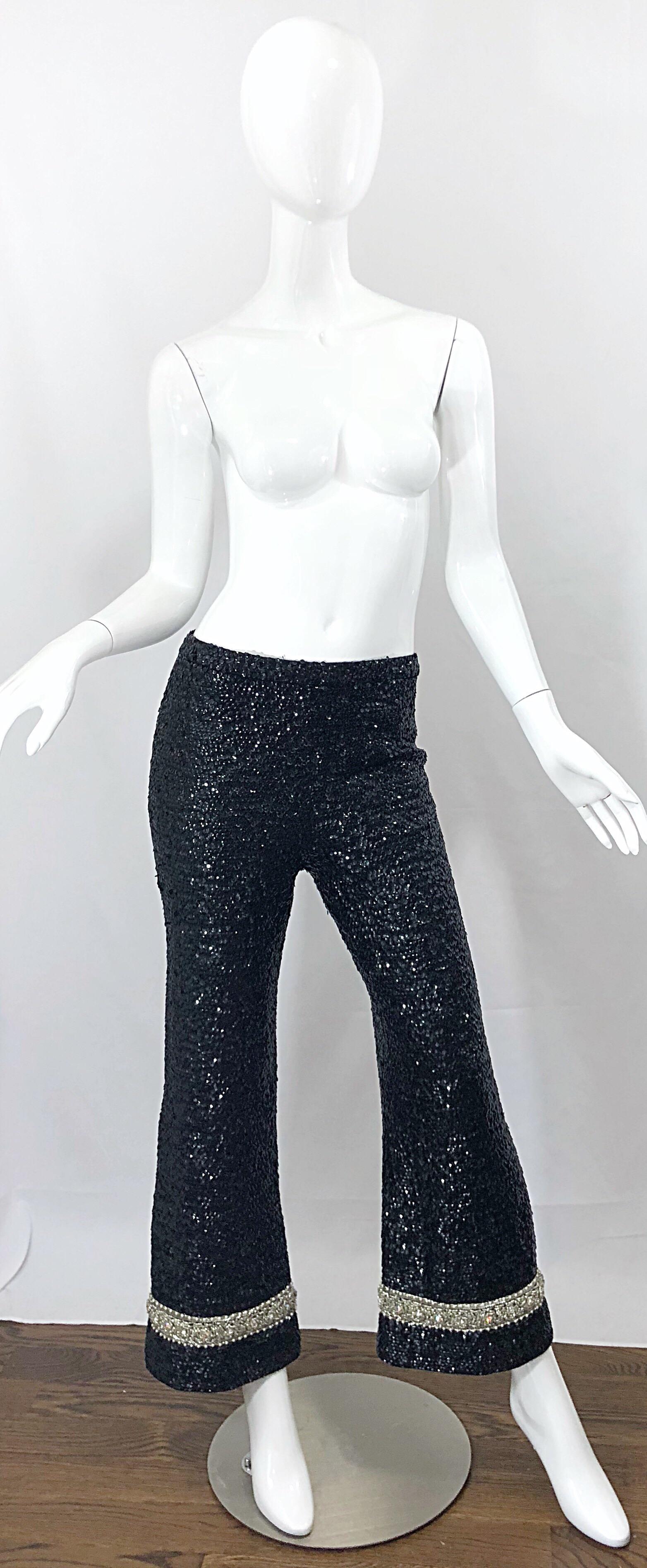 Fabulous vintage late 1960s DE PAUL OF NEW YORK black fully sequined slightly cropped flare leg pants! Features thousands of hand-sewn sequins throughout. Hem of each leg has a trim of iridescent beads, pearls and rhinestones. Super soft virgin wool