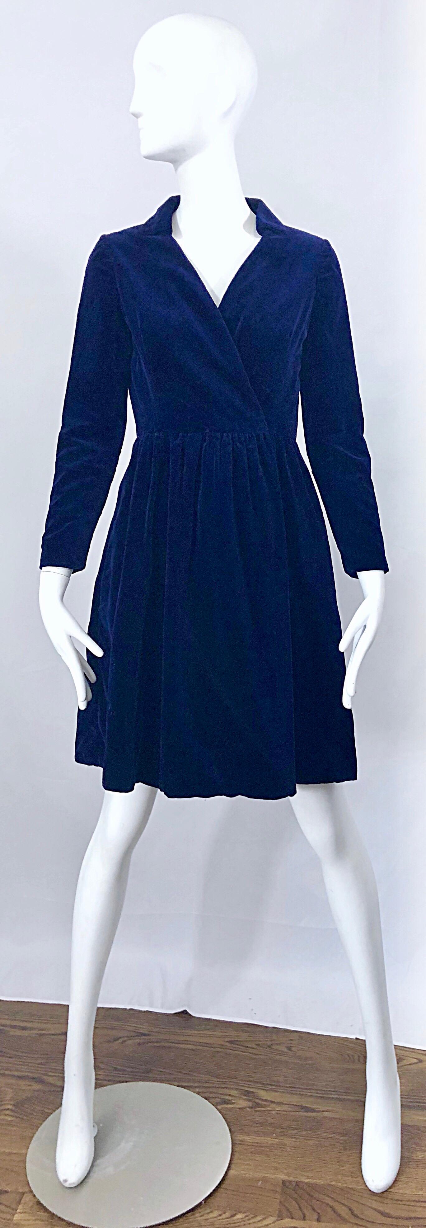 Chic mid 1950s ADELE SIMPSON navy midnight blue long sleeve wrap shirt dress! Features a flattering fitted bodice with a forgiving full skirt. Wrap style buttons on the interior left waist, with hook-and-eye closure and snap at exterior right waist.