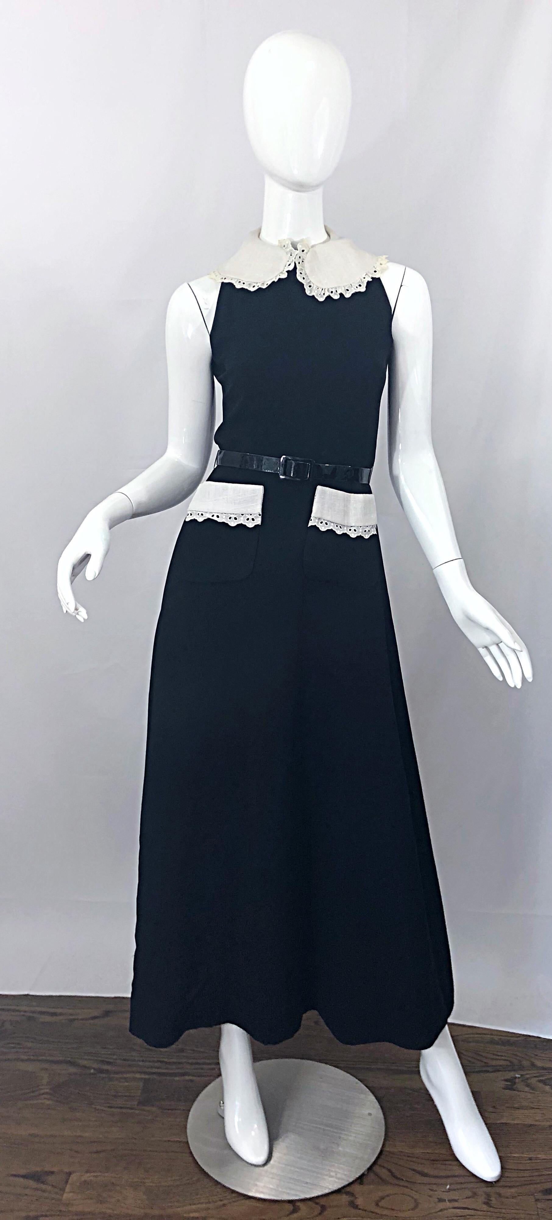 Beautiful early 1970s DONALD BROOKS black and white maxi dress gown ! Features a luxurious crepe rayon fabric that drapes wonderfully. Chic high neck with white linen eyelet collar, with matching white eyelet trim on each pocket at the waist.