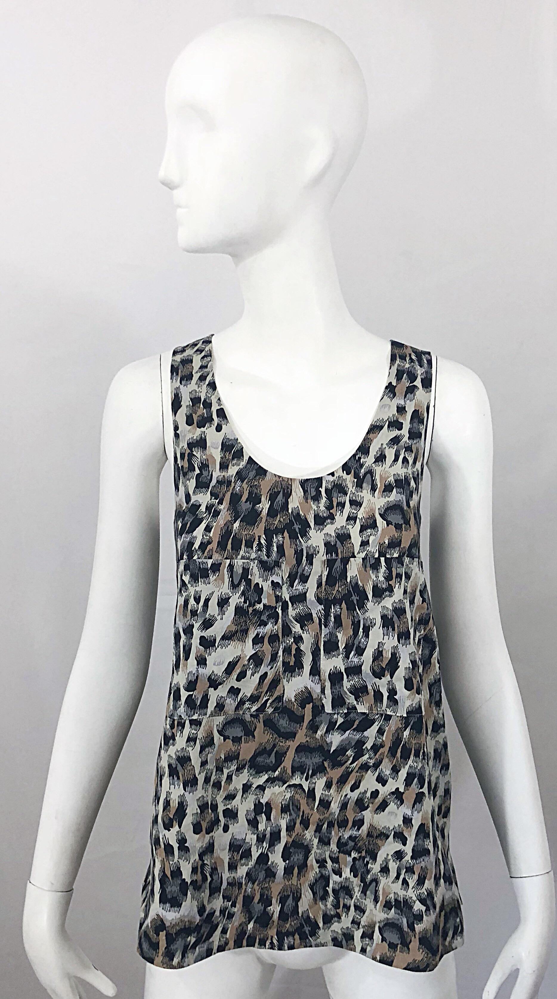 Chic vintage late 90s CHLOE leopard cheetah print sleeveless tunic shirt! Features flattering animal prints in grey, brown, ivory and tan throughout. Pocket at each breast. Vents at each side of the hem. Soft cotton, and fully lined in silk. Fitted