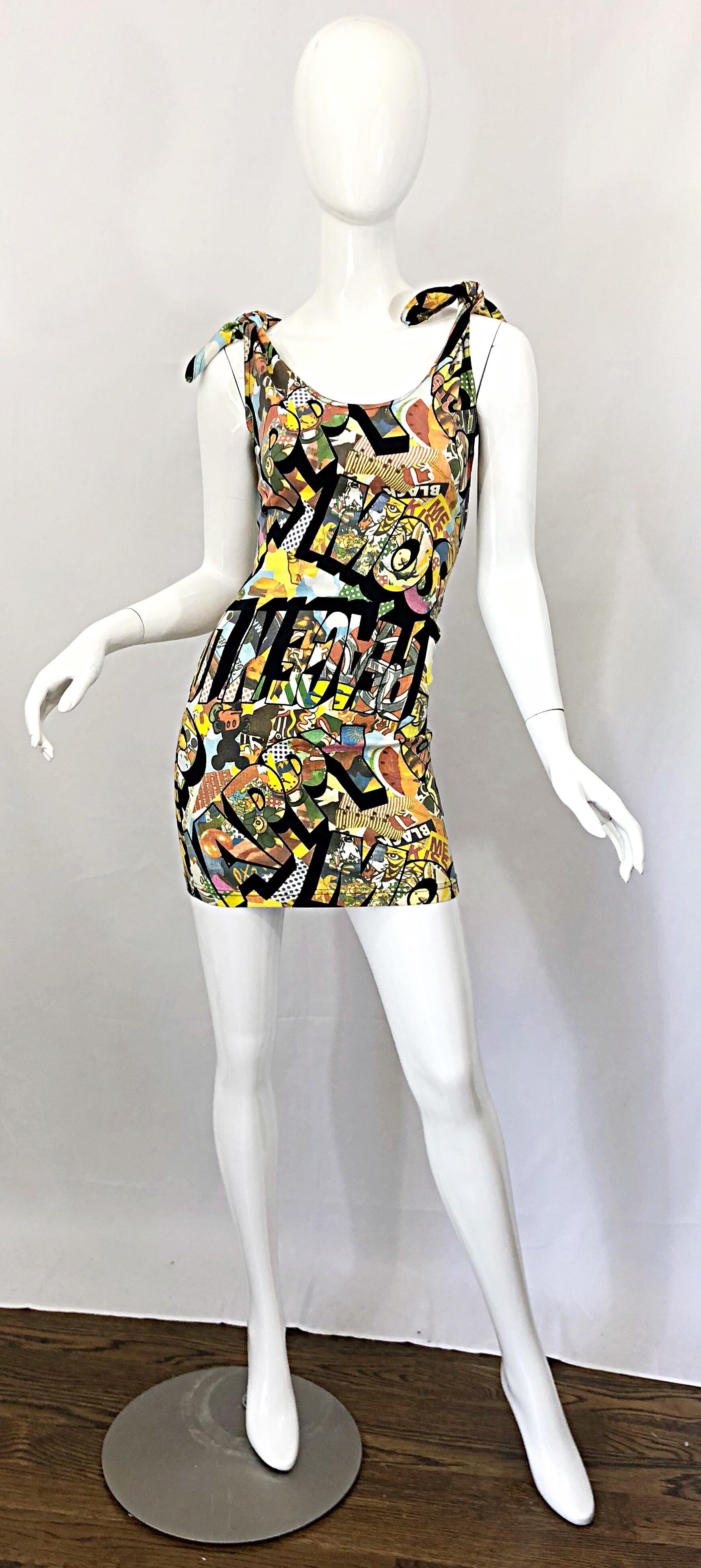Rare and iconic 1990s MOSCHINO novelty print sexy mini dress! Features all of the cartoon characters Moschino used in the 90s. Mickey Mouse, Minnie Mouse, Popeye, Olive Oyl, amongst others. Hidden zipper up the side. Comfortable Cotton (98%) and