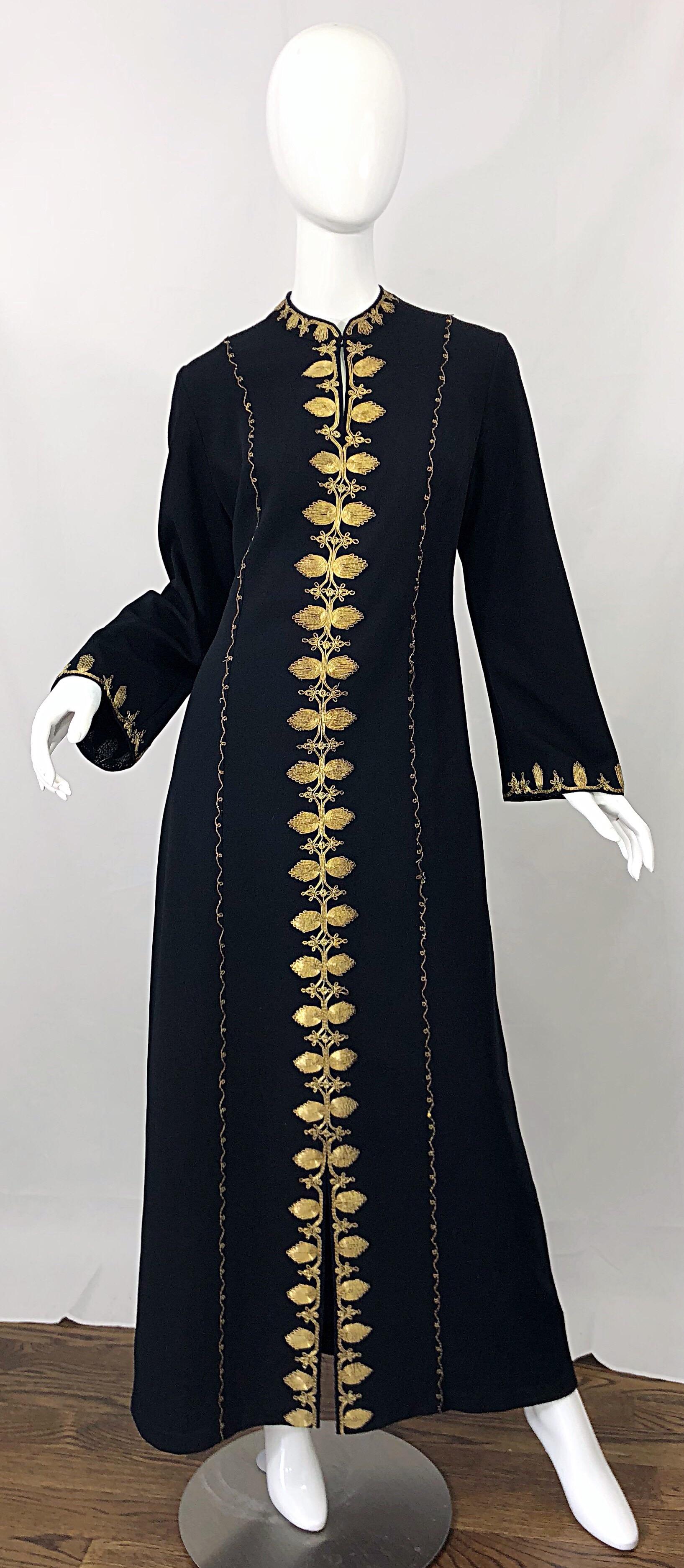 Amazing 1970s black crepe Moroccan long sleeve kaftan maxi dress! Features meticulously embrodiered gold metal throughout. Chic bell /angel sleeved have just the right amount of flare. Hook-and-eye closure at top neck creates a keyhole affect, or