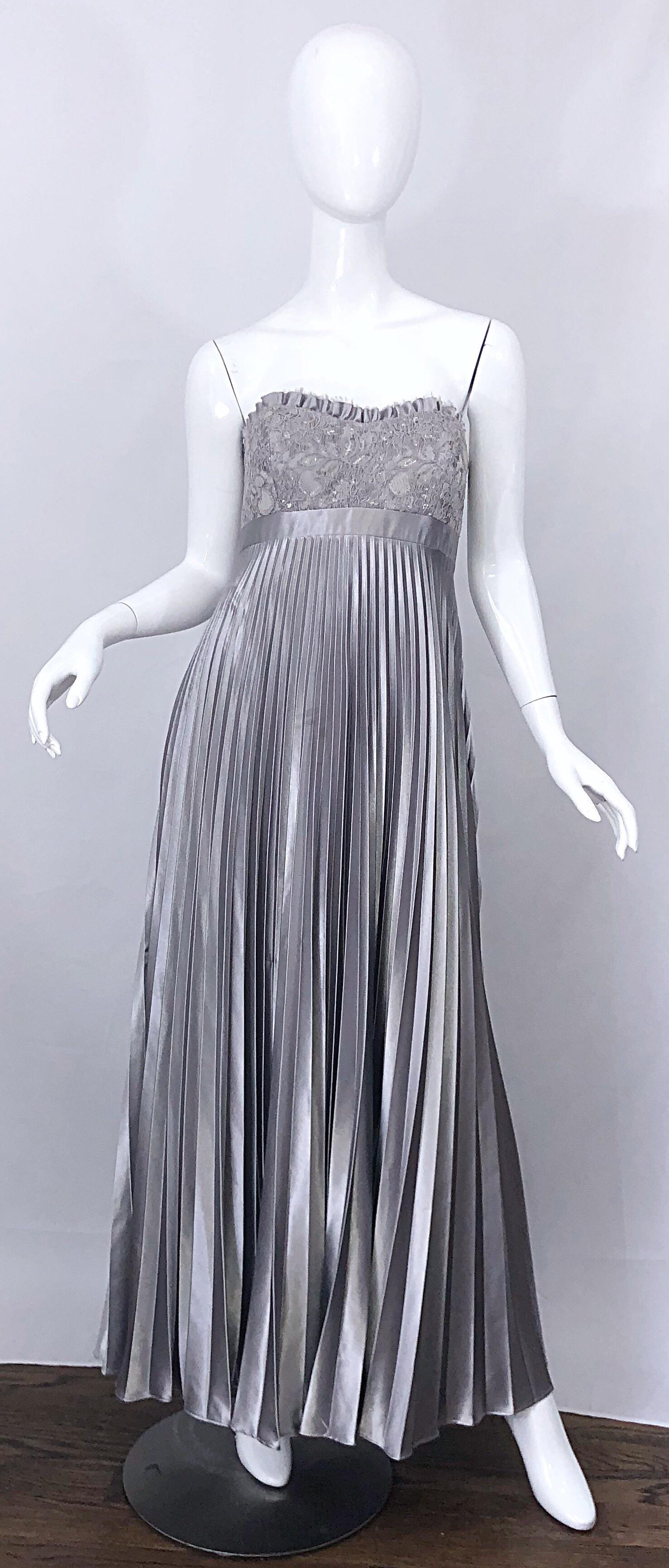 Beautiful vintage 90s BADGLEY MISCHKA Couture quality metallic silver gray strapless evening gown! Features a fitted boned lace bodice with silver sequins hand-sewn throughout. Flattering and forgiving empire waist accordian pleated skirt. Hidden