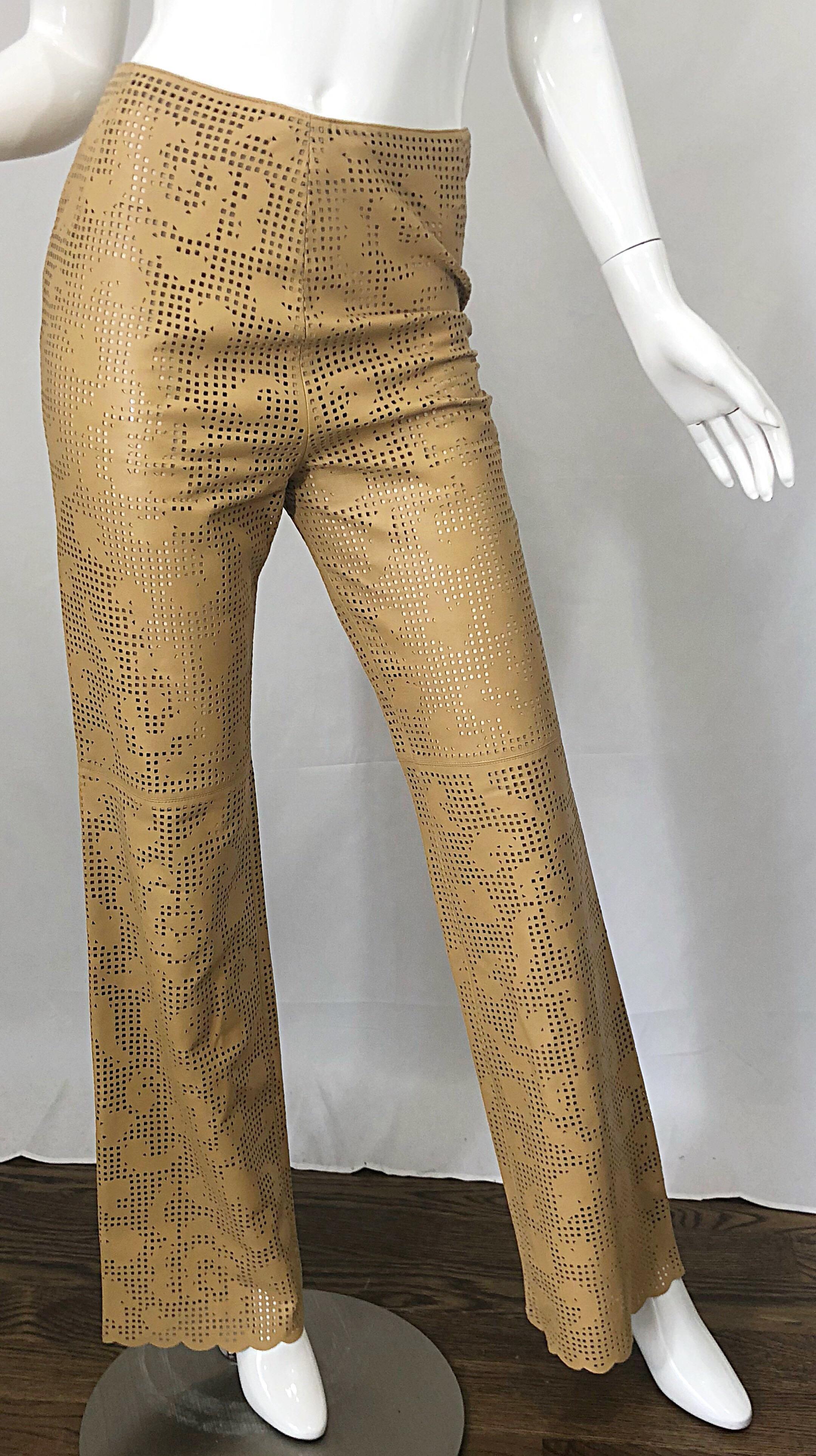 Never worn 1990s vintage OSCAR DE LA RENTA for NEIMAN MARCUS tan light brown laser cut - out leather high waisted flared boot cut pants! Features all over strategically placed 
cut-outs throughout. Super soft luxurious durable leather. Slimming high