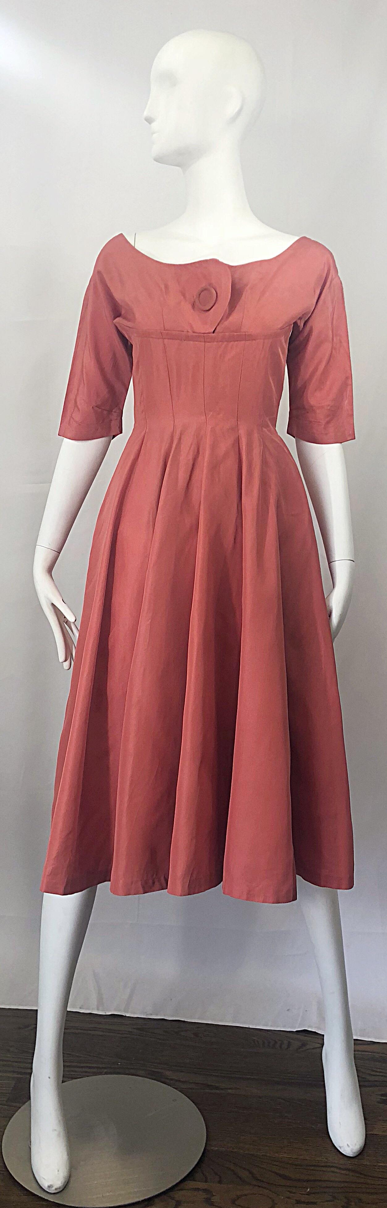 Beautiful 1950s GIG YOUNG salmon / coral pink silk taffeta fit n' flare 3/4 sleeves dress! Features a wonderful flattering tailored bodice with a forgiving full skirt, which could also accomodate a crinoline for extra fullness. Perfect 3/4 sleeve