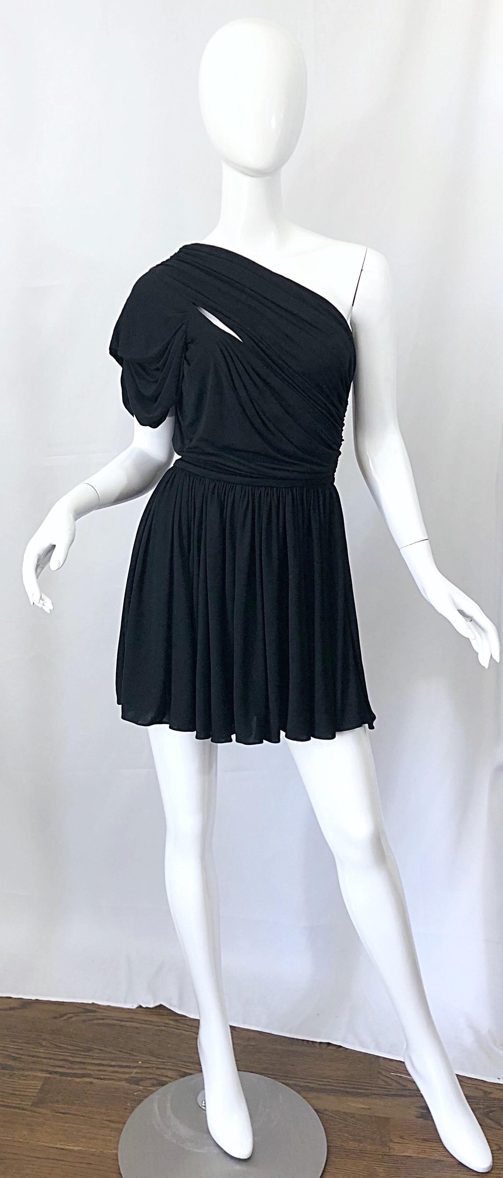 Sexy, yet classic early 2000s JOHN GALLIANO black one shoulder rayon jersey dress! Brand new with tags. Features cut-outs above the right bust in the front, and matching in the back. Drapes wonderfully, and really flatters the body. Hidden zipper up