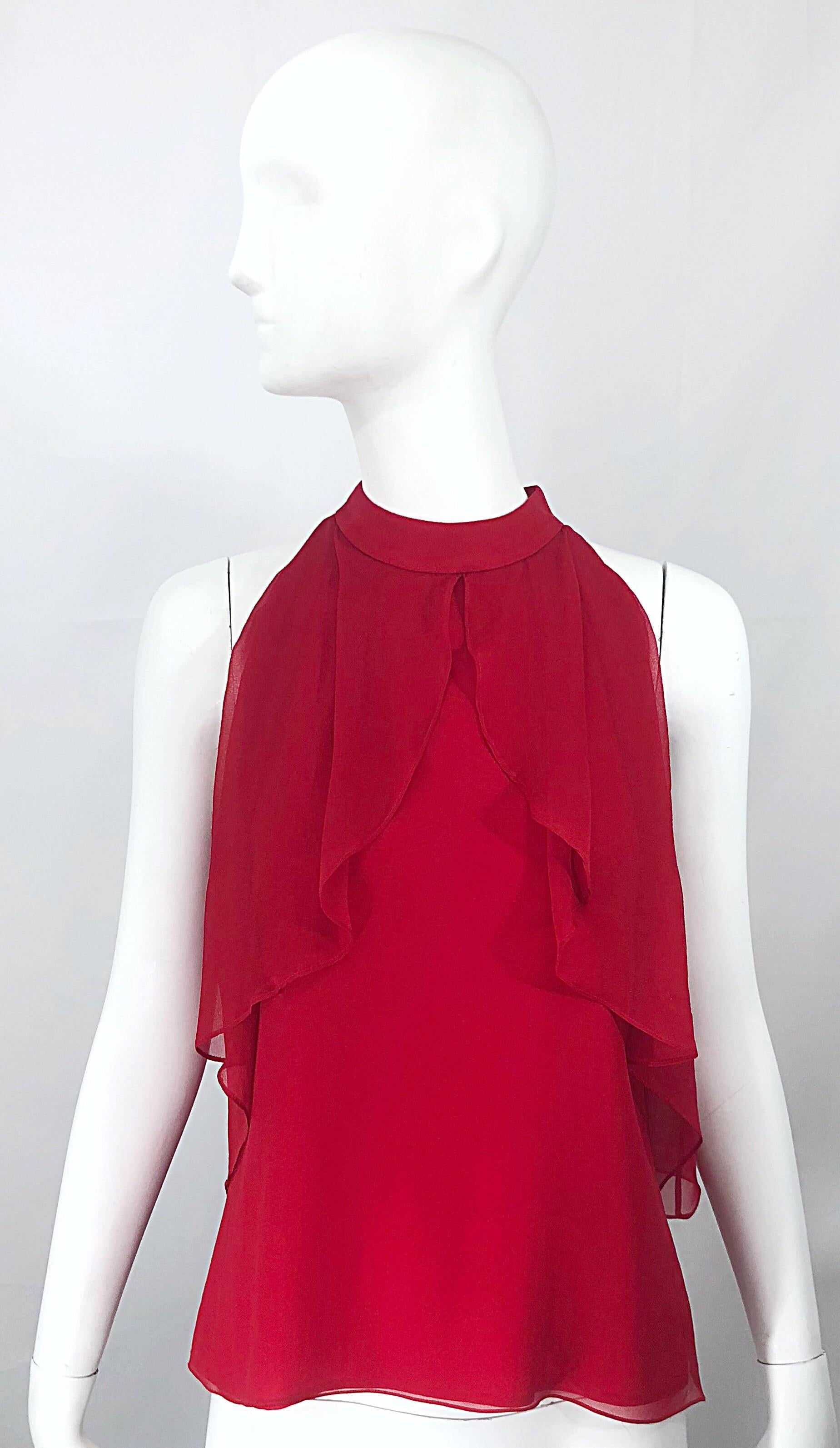Chic early 2000s CHIRSTOPHER DEAN lipstic red silk chiffon sleeveless blouse! Features flattering and playful ruffles at each side of the bodice. Peek-a-boo in the back reveals just the right amount of skin. Great for the upcoming holidays! Can