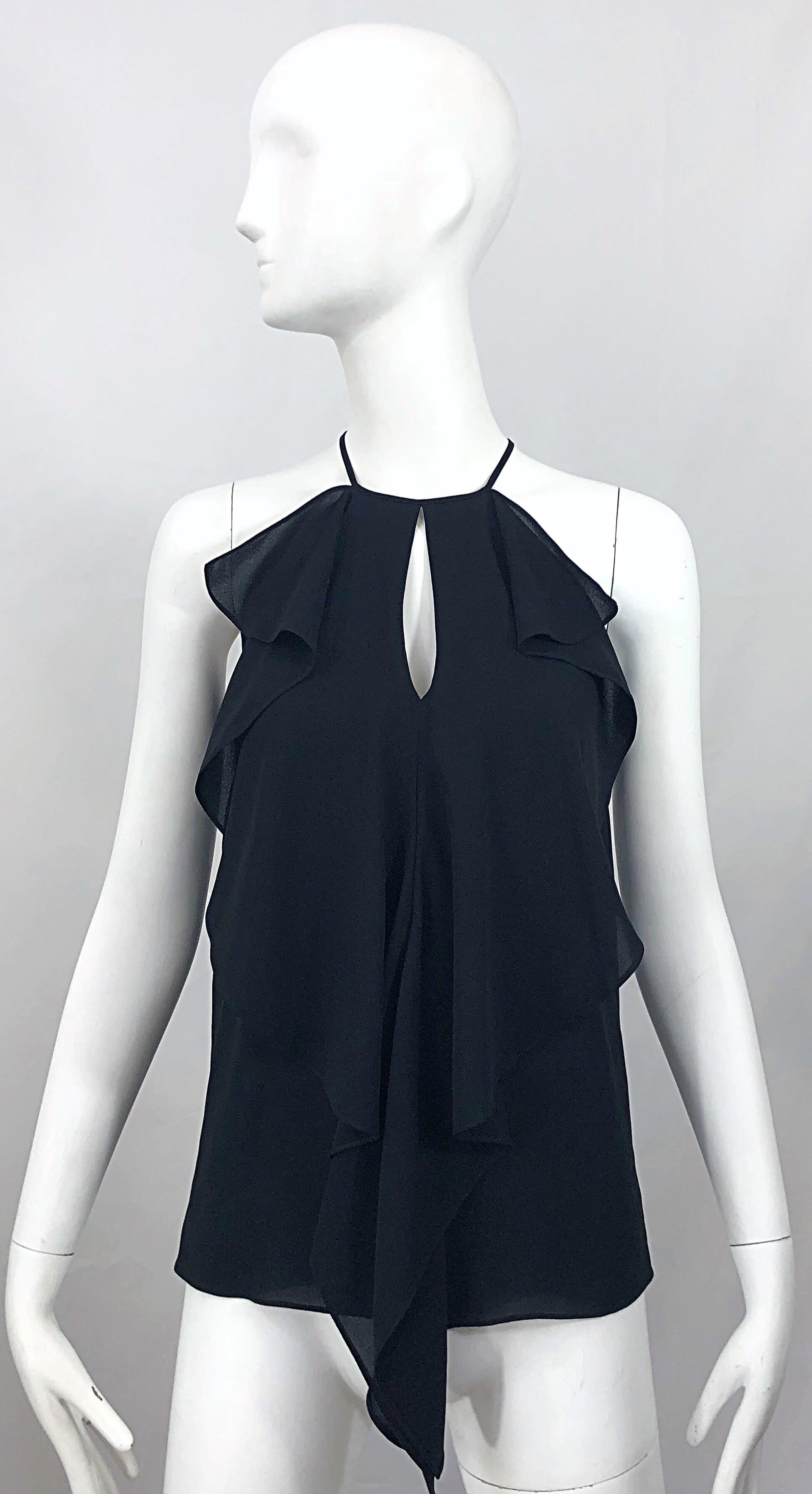 Stylish MICHAEL KORS COLLECTION black silk chiffon keyhole sleeveless flutter blouse! Features flattering chiffon drapes on each side, with a keyhole opening at center bust that reveals just the right amount of skin. Hidden zipper up the back with