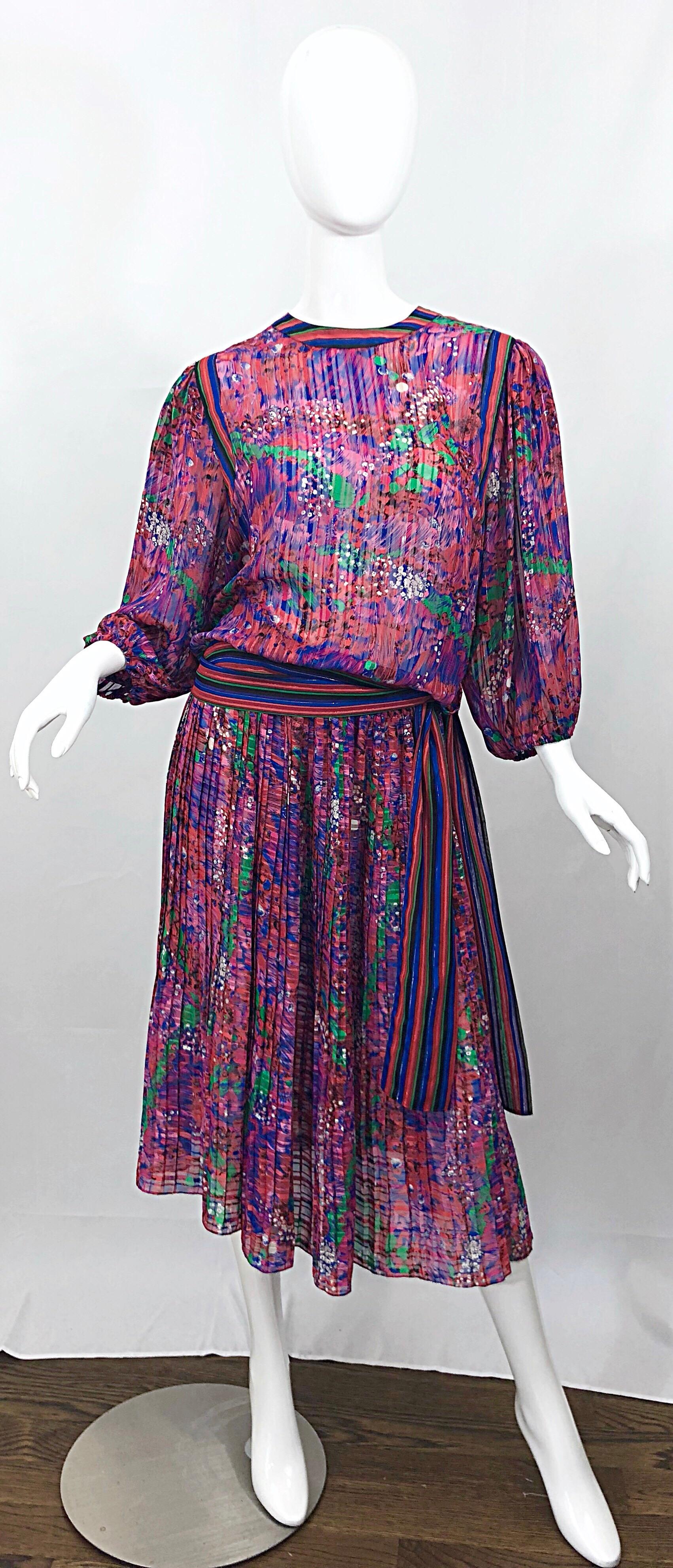 Fabulous vintage 80s DIANE FREIS flowers and stripes two piece boho dress ensemble! Features vibrant colors of pink, purple, green and blue, with metallic threads throughout. Signature Diane Fres style that is easy and breezy. Blouse has two buttons